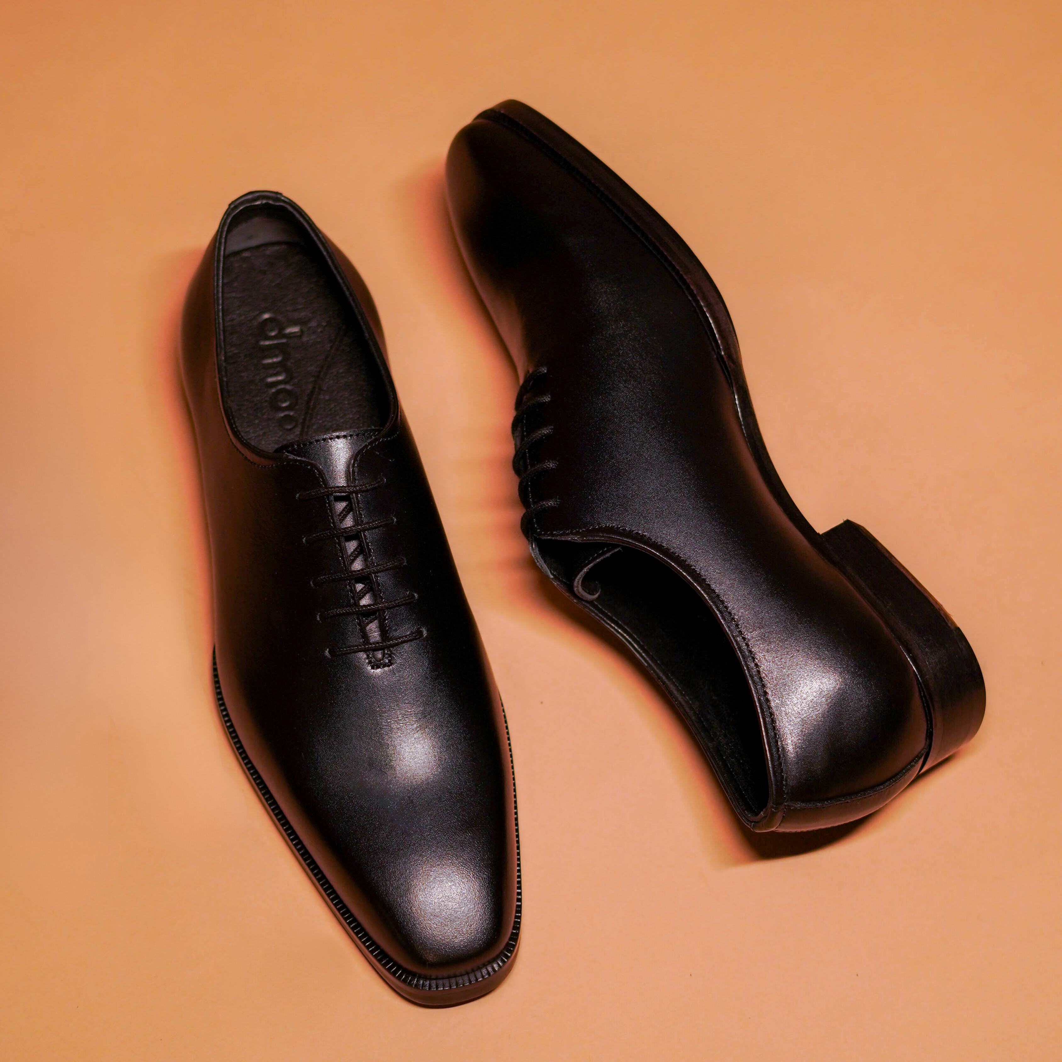 dmodot Belismo Nero in exquisite black leather, luxury hole cut Oxford with modern square toe.
