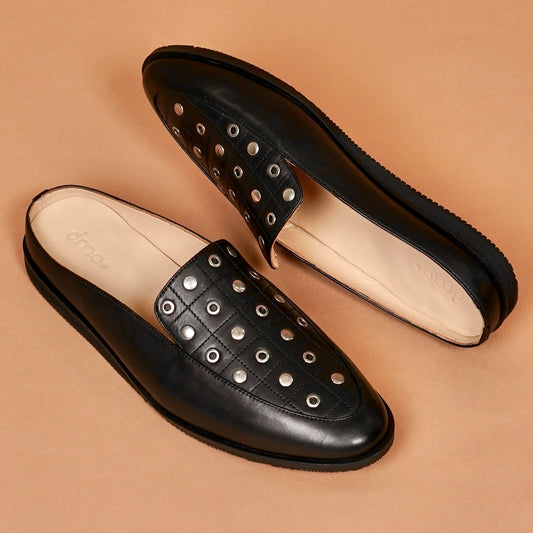 Top angle of Hoffler Nero Riveto black mule with metal studs and quilted detailing