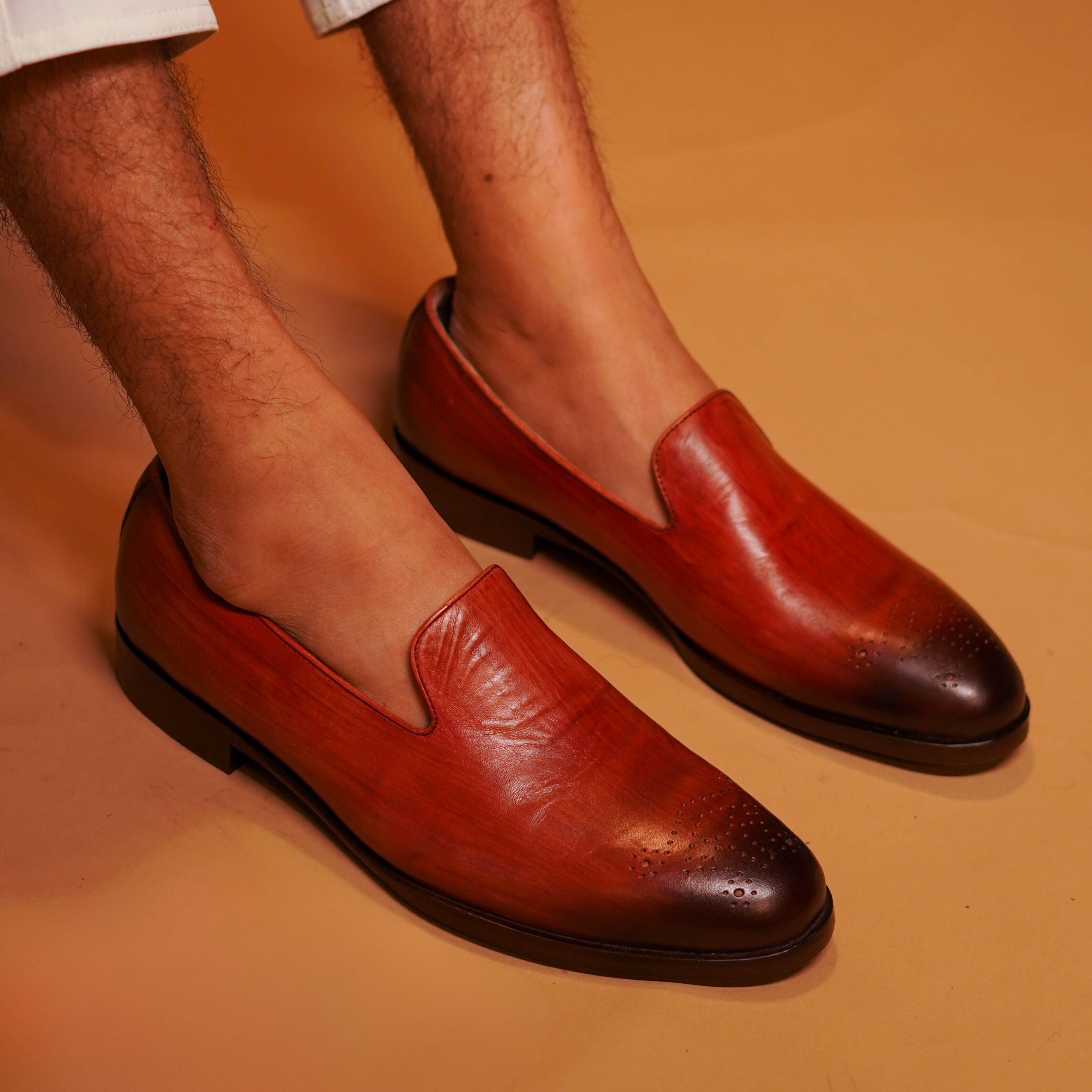 Motivo Bronzo | Tan full-grain brogue loafers