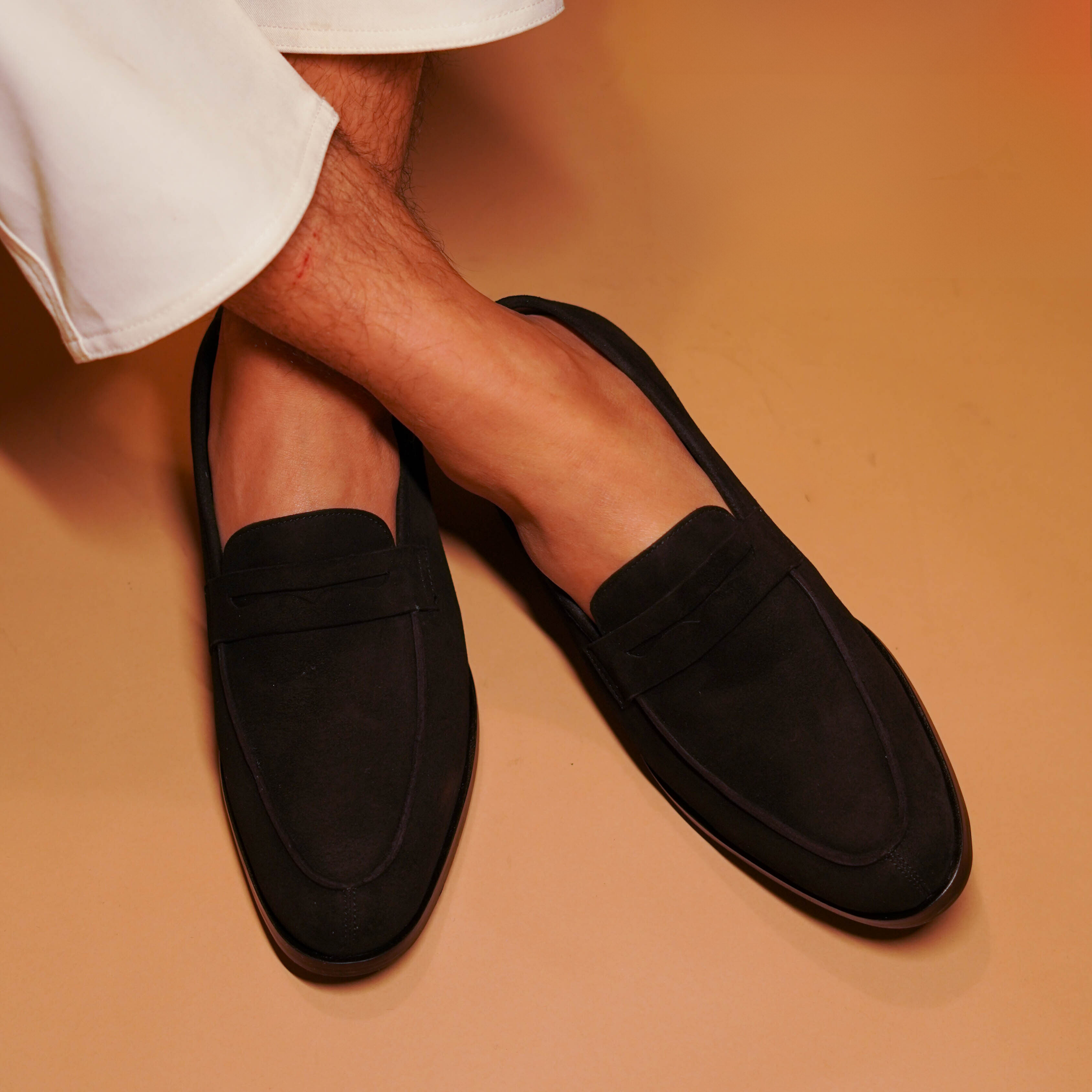 Nero | Classic black suede penny loafers