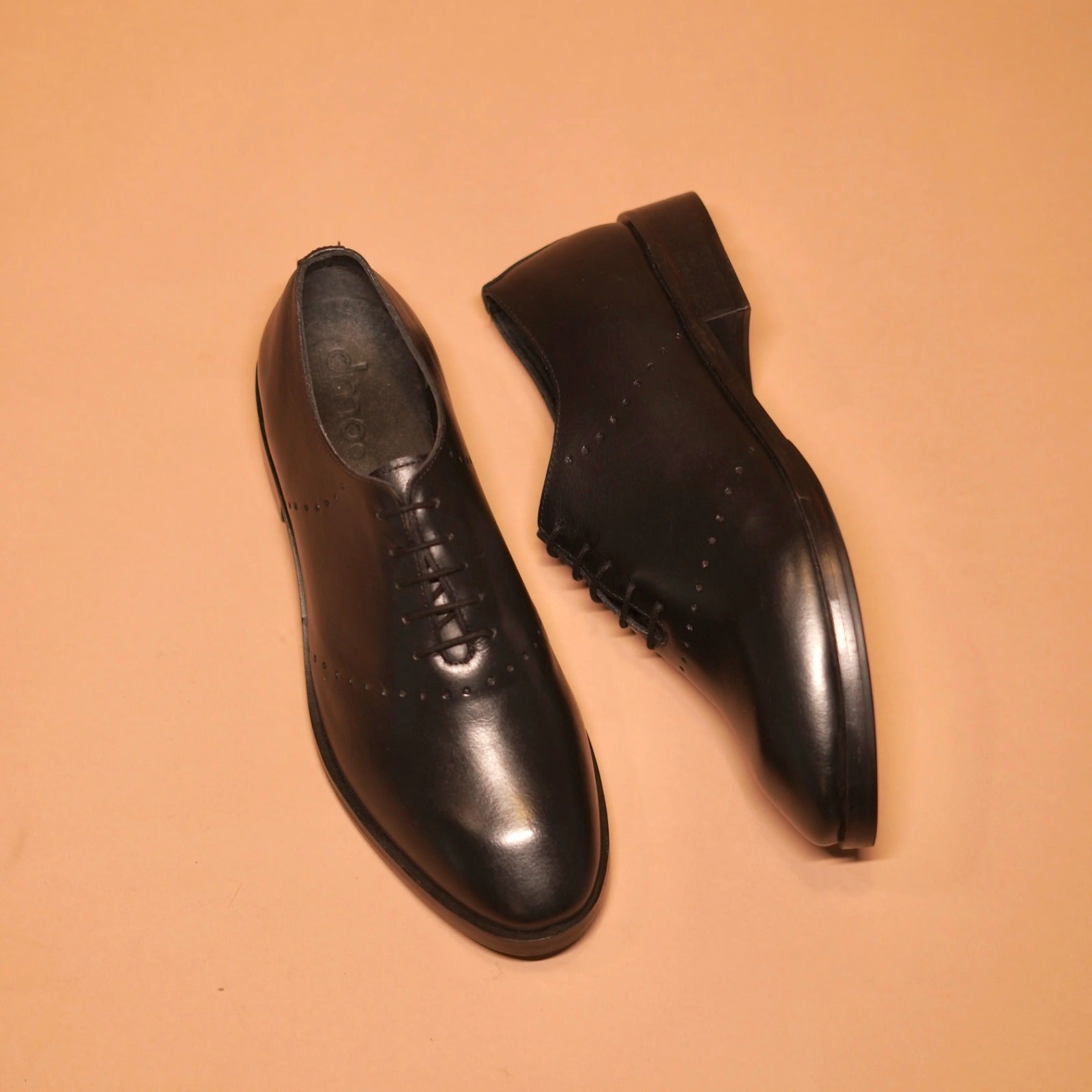 Carrero | Black leather Oxfords with minimal detail