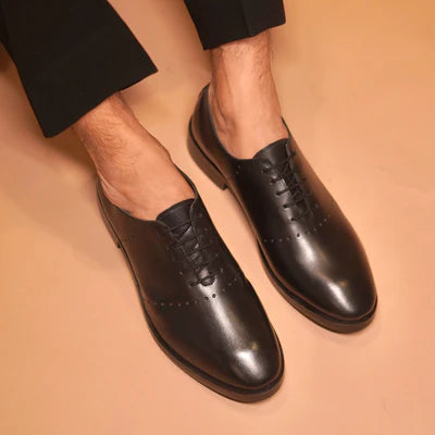 Carrero | Black leather Oxfords with minimal detail