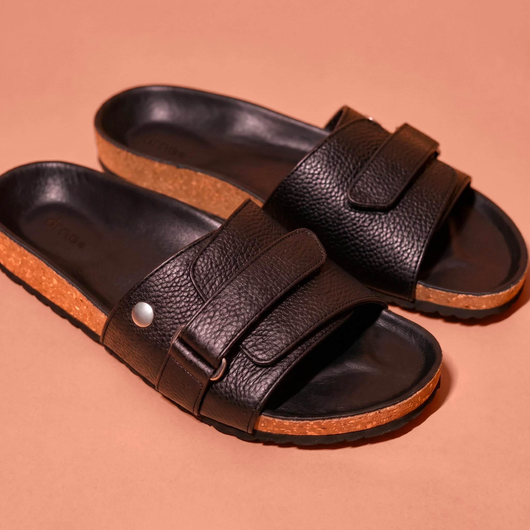 Close-up of cork footbed and rivet strap on Corko Nero Scuro