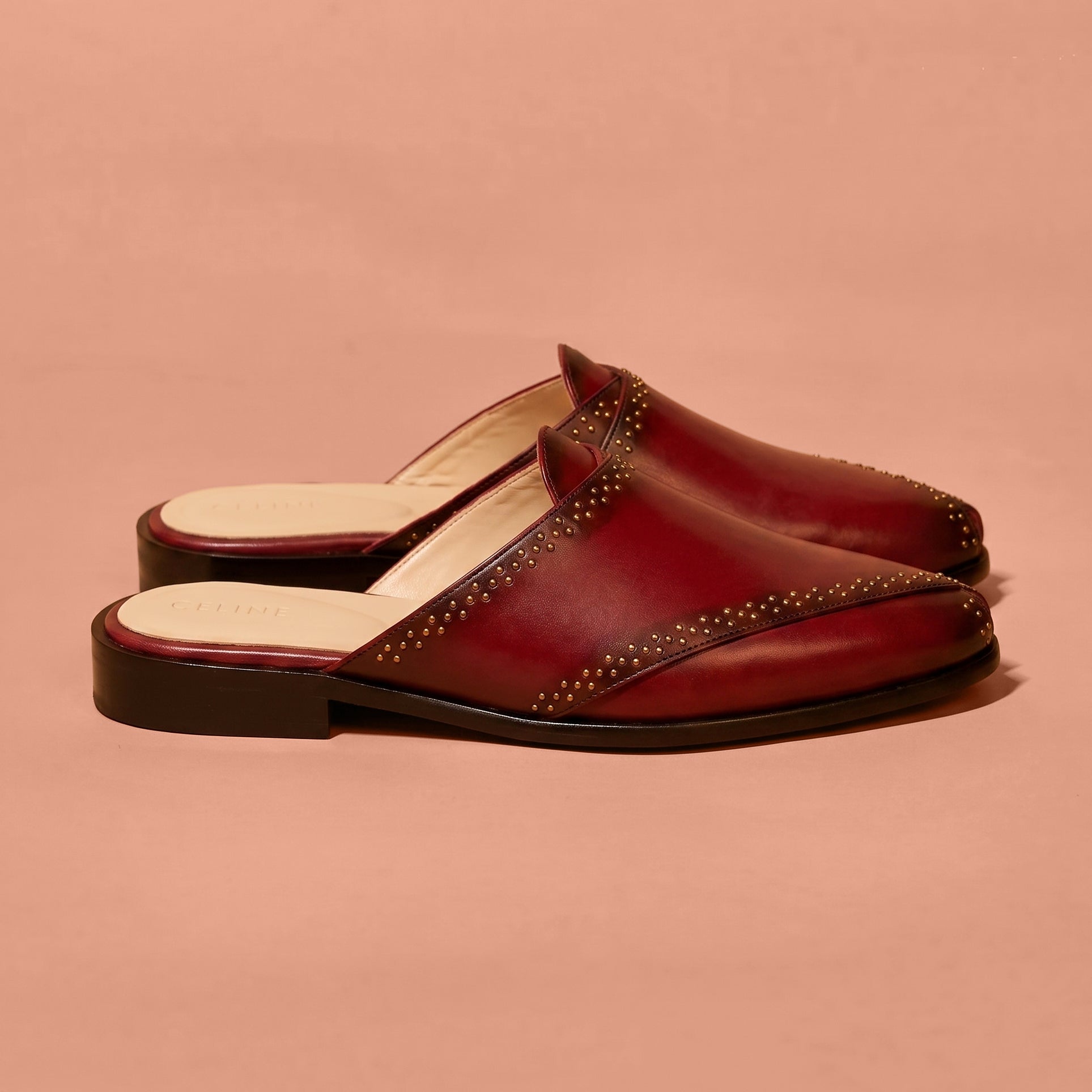 Cherry red leather mule with golden rivet detailing