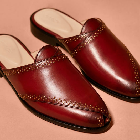 Close-up of golden rivet accents on Hoffler Rossa Riveto