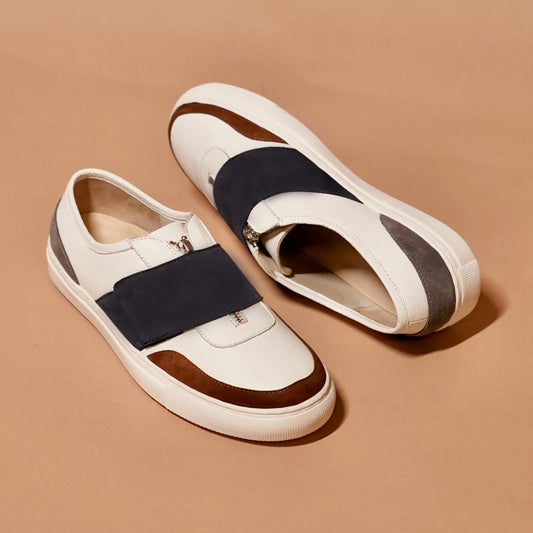 White and navy men’s sneakers with suede toe detail