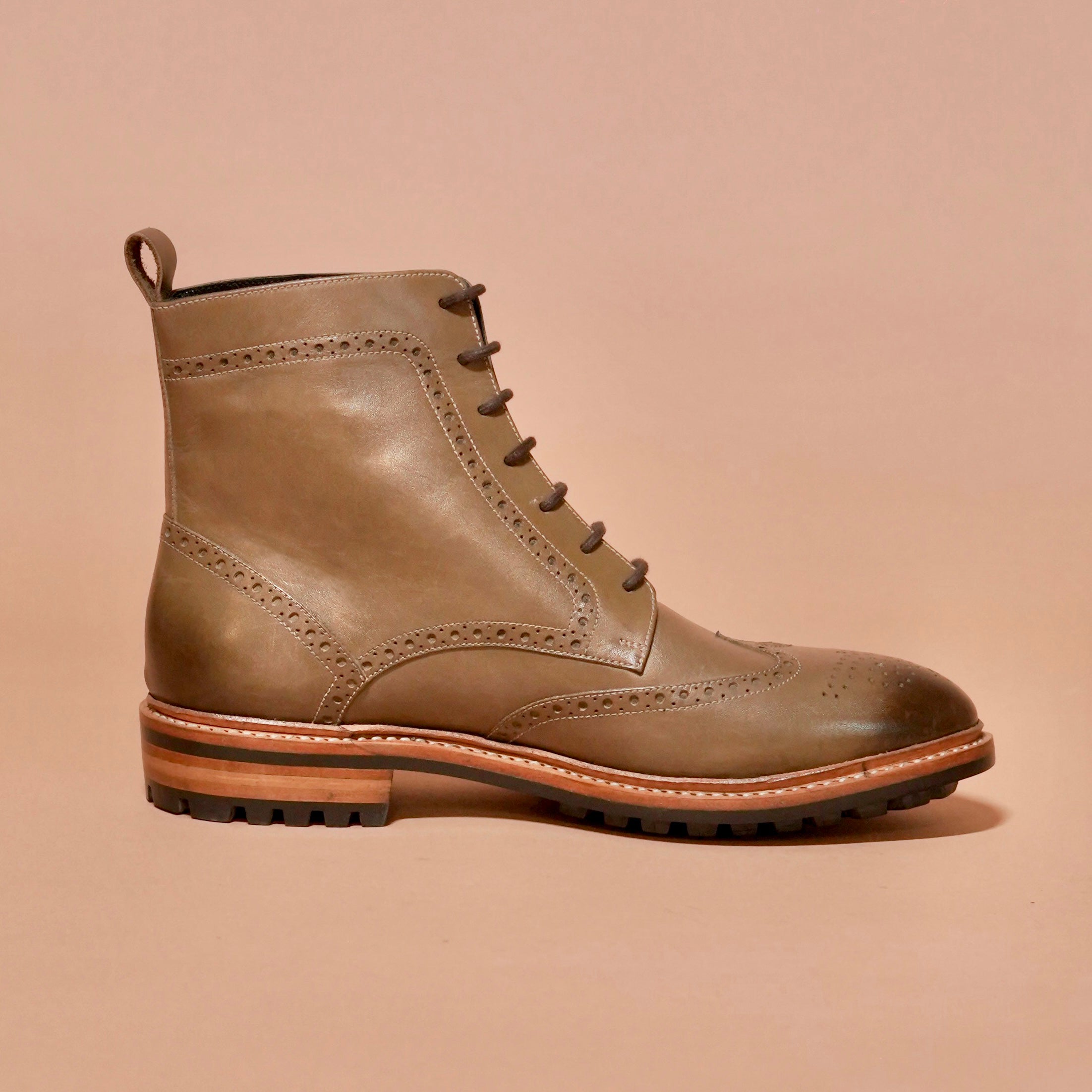 Side view of Sprazzo Welto Verdo showcasing brogue detailing and dual-tone olive finish