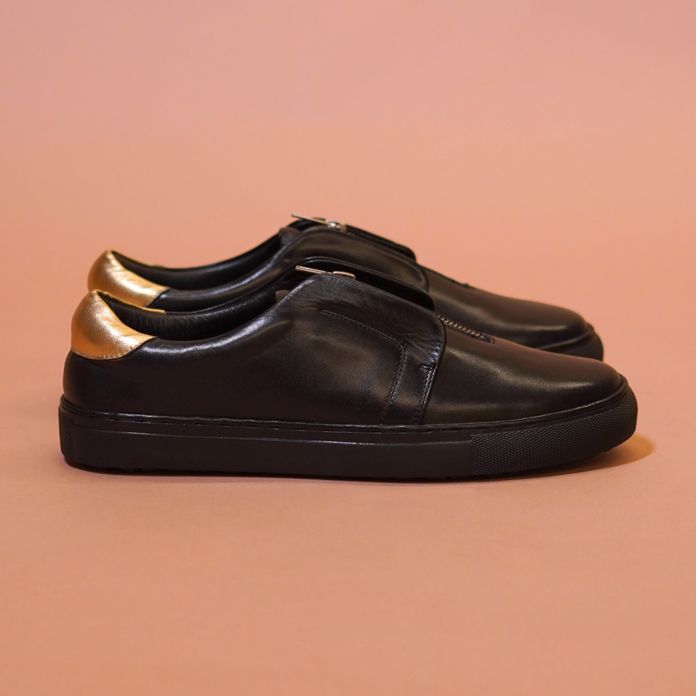 Pigro Nero | Black and gold zip-up leather sneakers