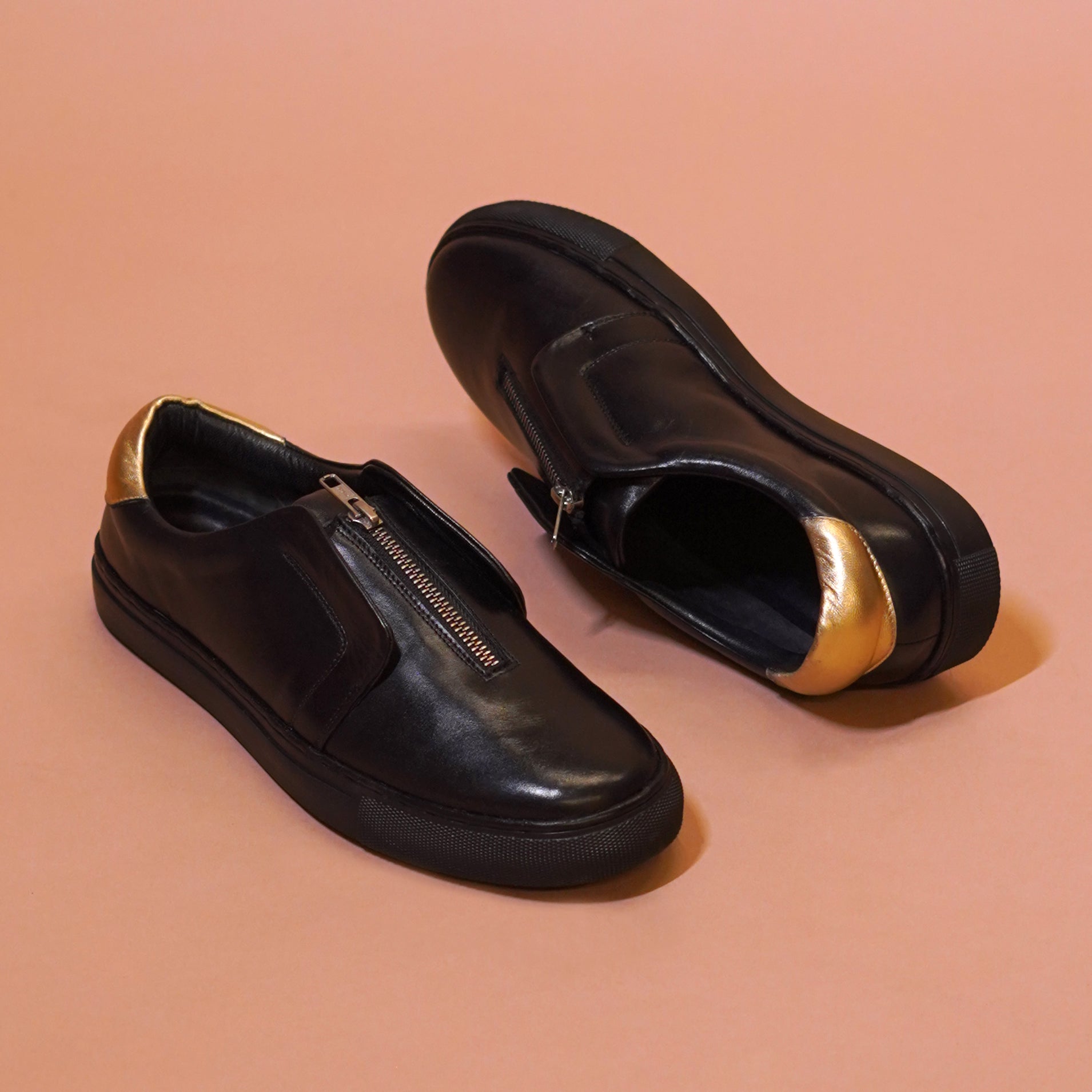 Pigro Nero | Black and gold zip-up leather sneakers