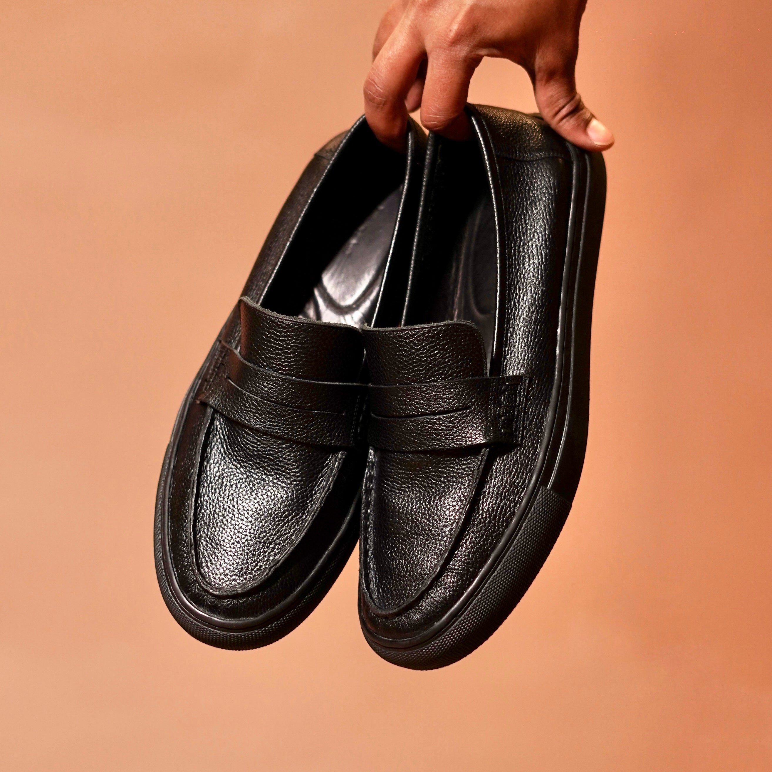 Top angle of Tristo highlighting penny strap loafer detailing