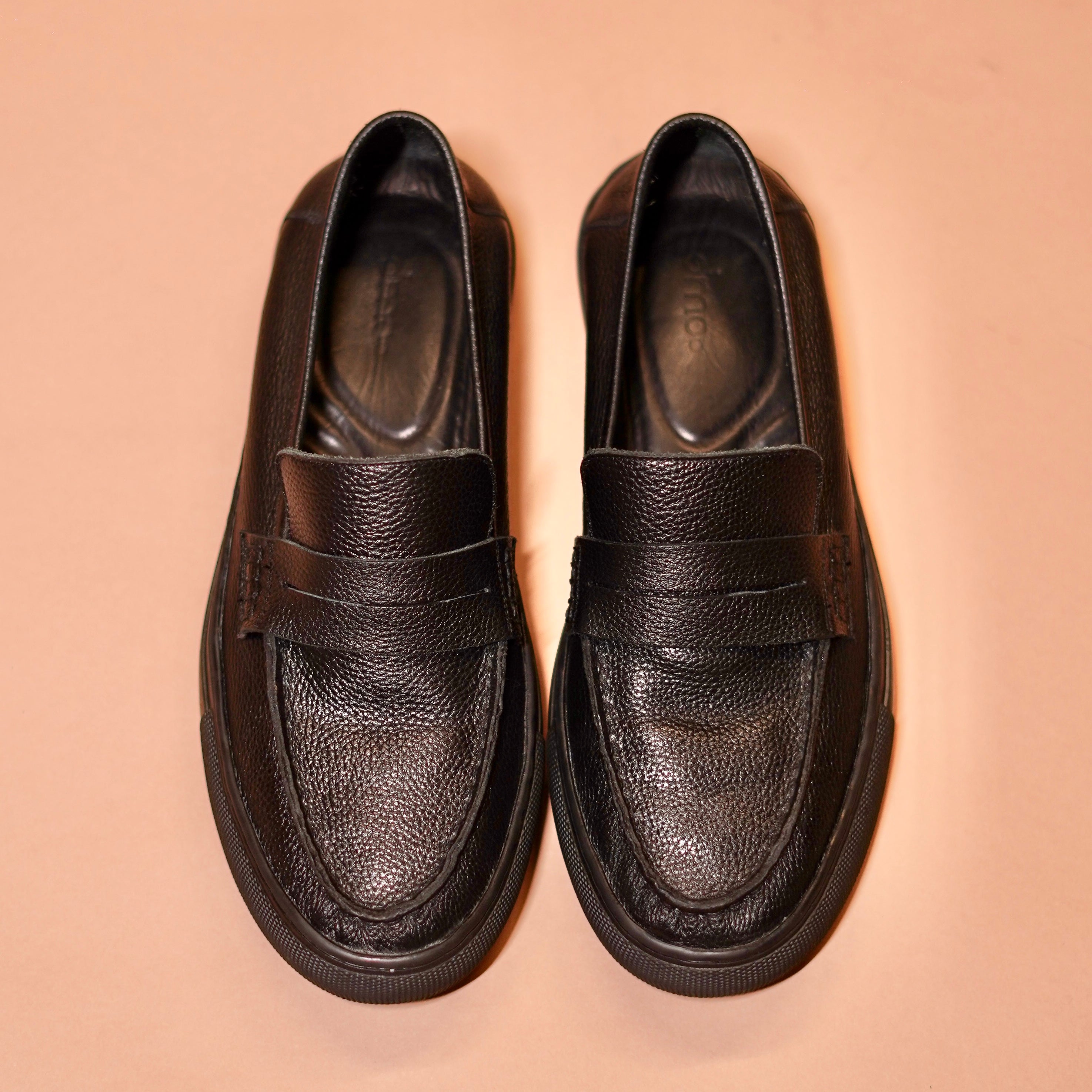 Top angle of Tristo highlighting penny strap loafer detailing
