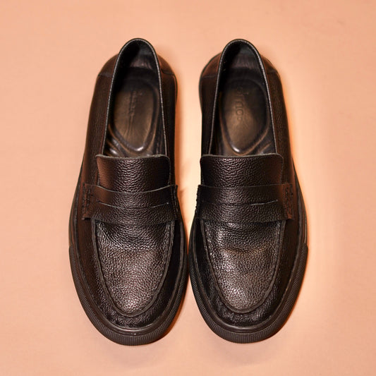 Top angle of Tristo highlighting penny strap loafer detailing