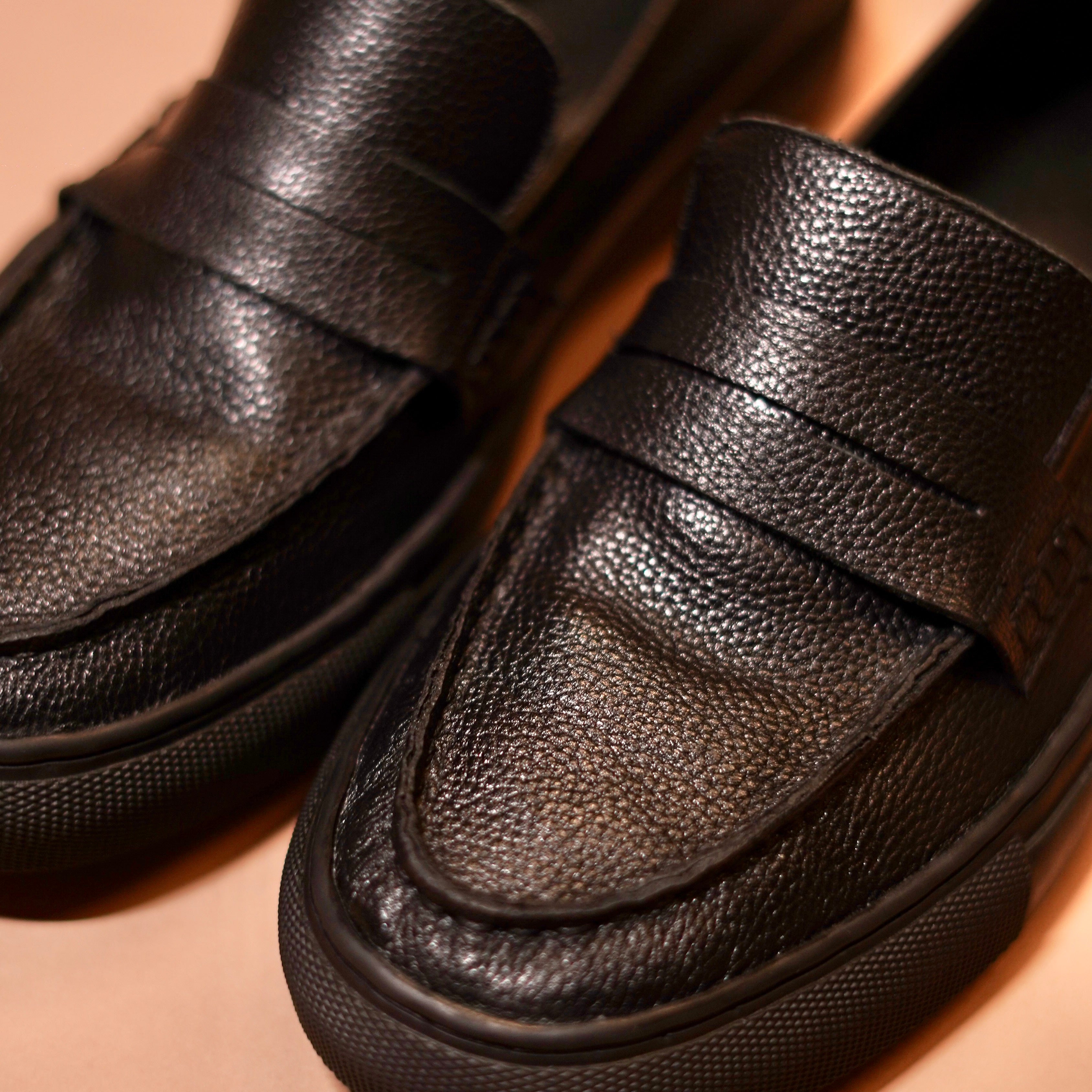 Close-up of Tristo’s textured black leather finish