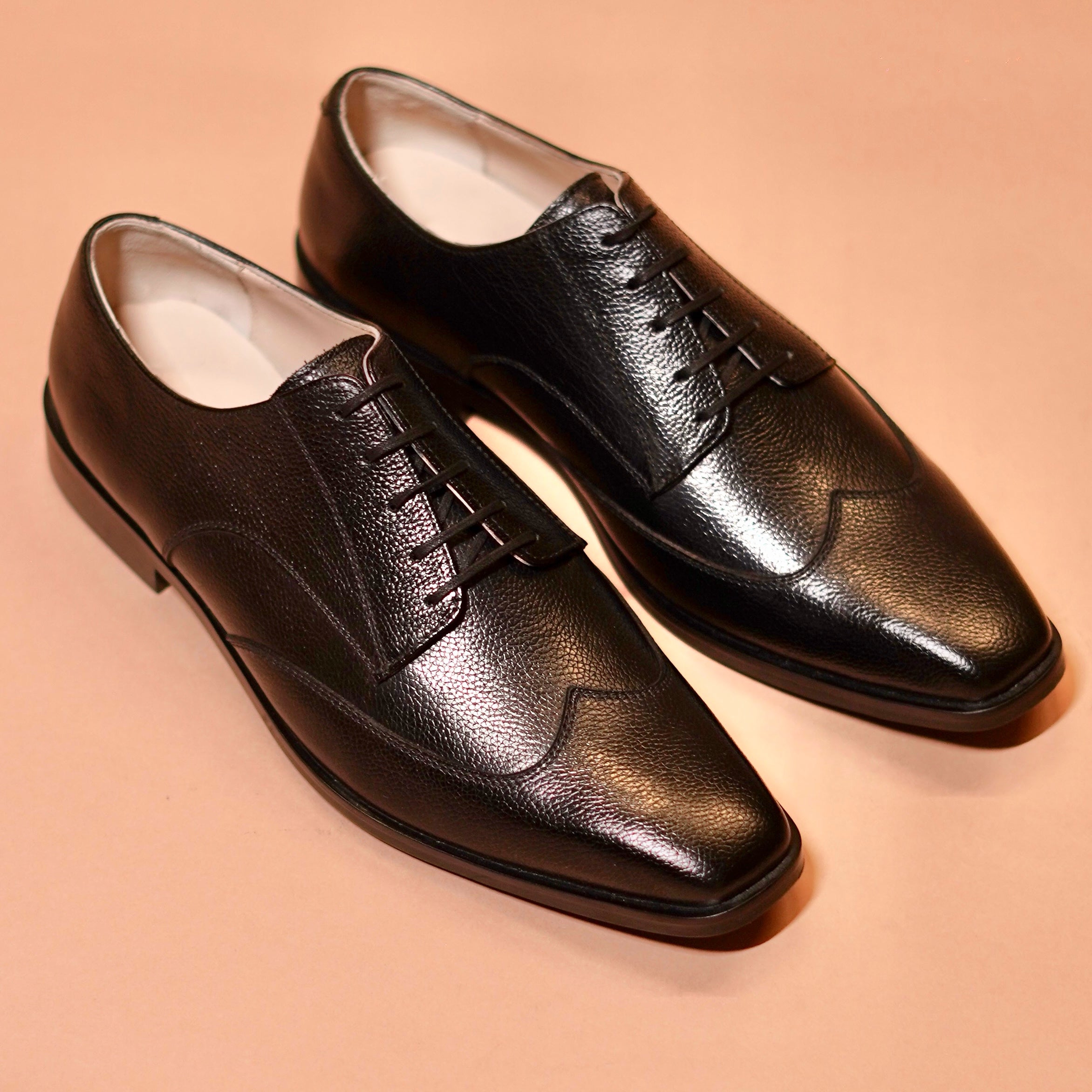 Carbo Nero styled with a black suit for a formal business look