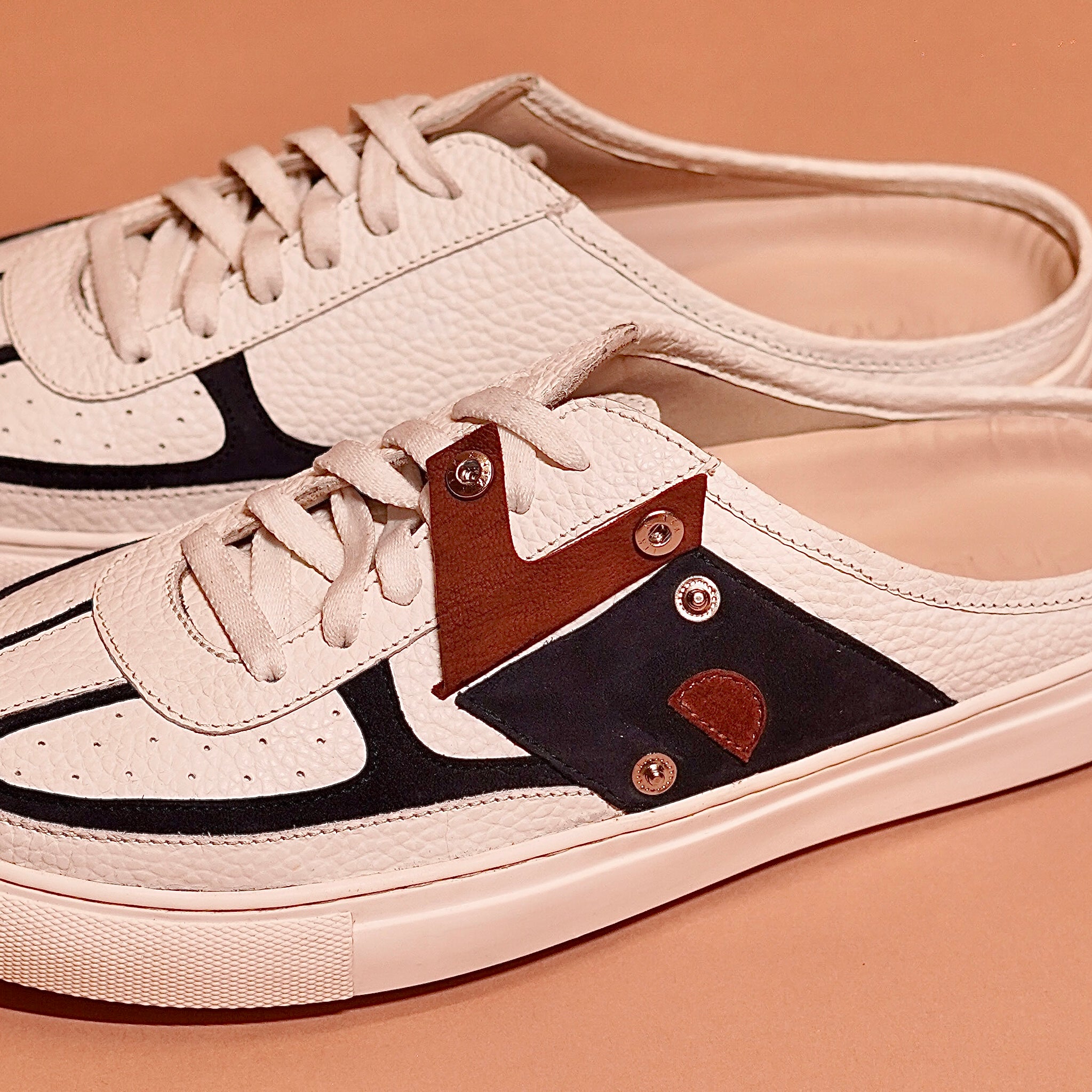 Close view of Freddo Bianco white leather sneaker mule with lace detail