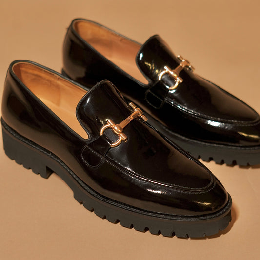 Close-up of patent leather finish and ornament