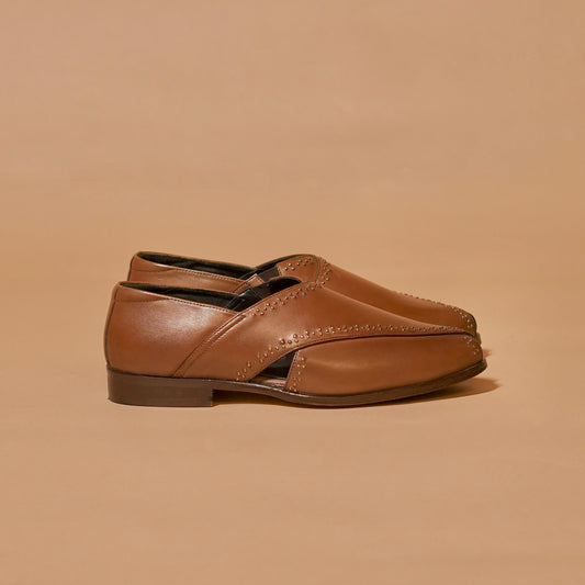 Side profile of Pesha Rivetto leather shoes