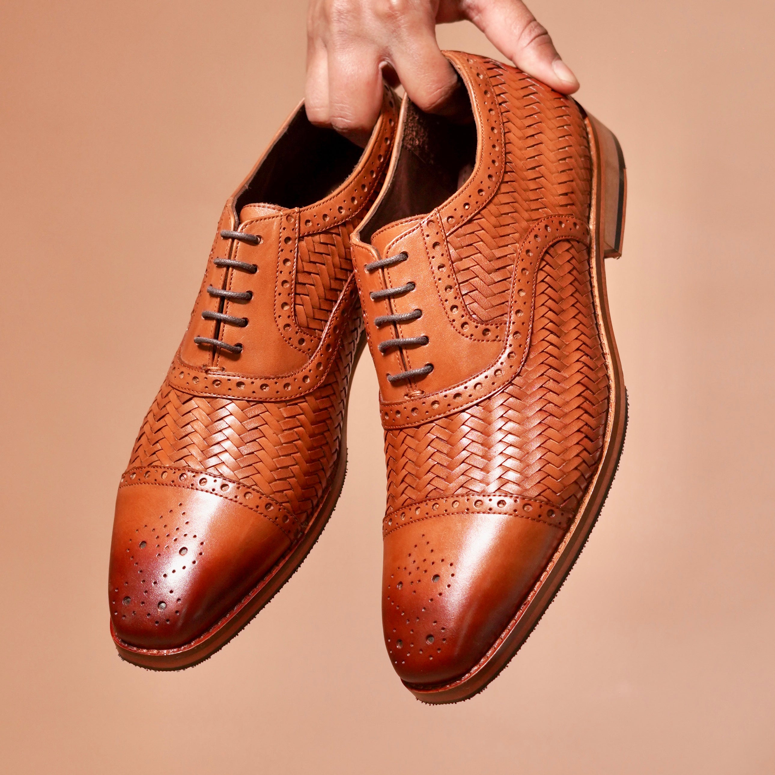 Capto Tesso Bruno styled with a formal beige suit for an elegant look