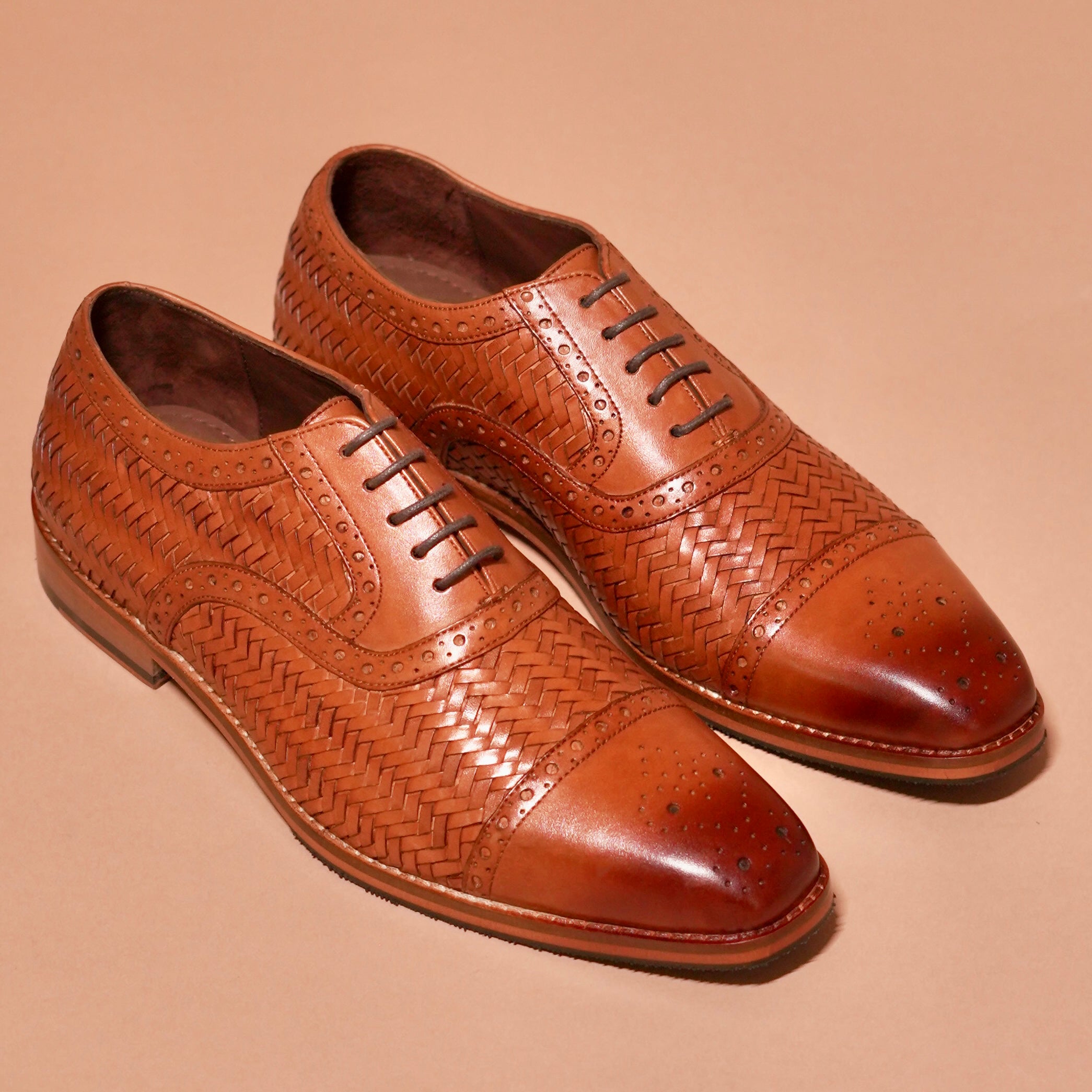 Capto Tesso Bruno styled with a formal beige suit for an elegant look