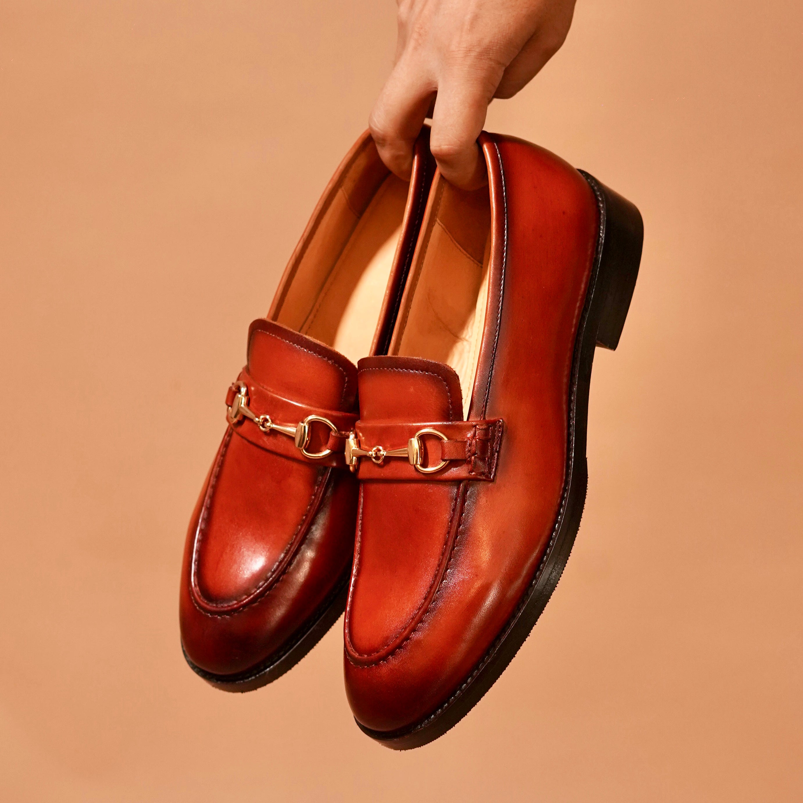 Top angle of Moccasino Fibio Bruno highlighting gold hardware and patina detailing