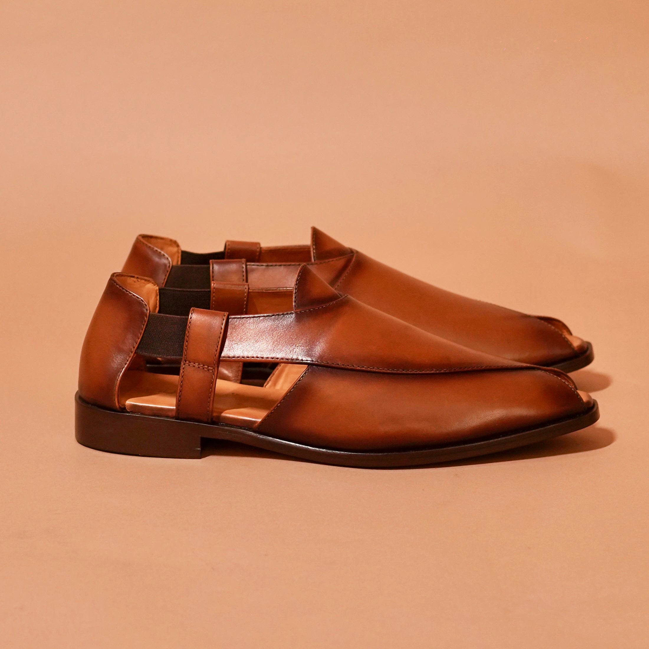 Side view of Pesha Piazzo Bruno showing cross-strap and cutout silhouette