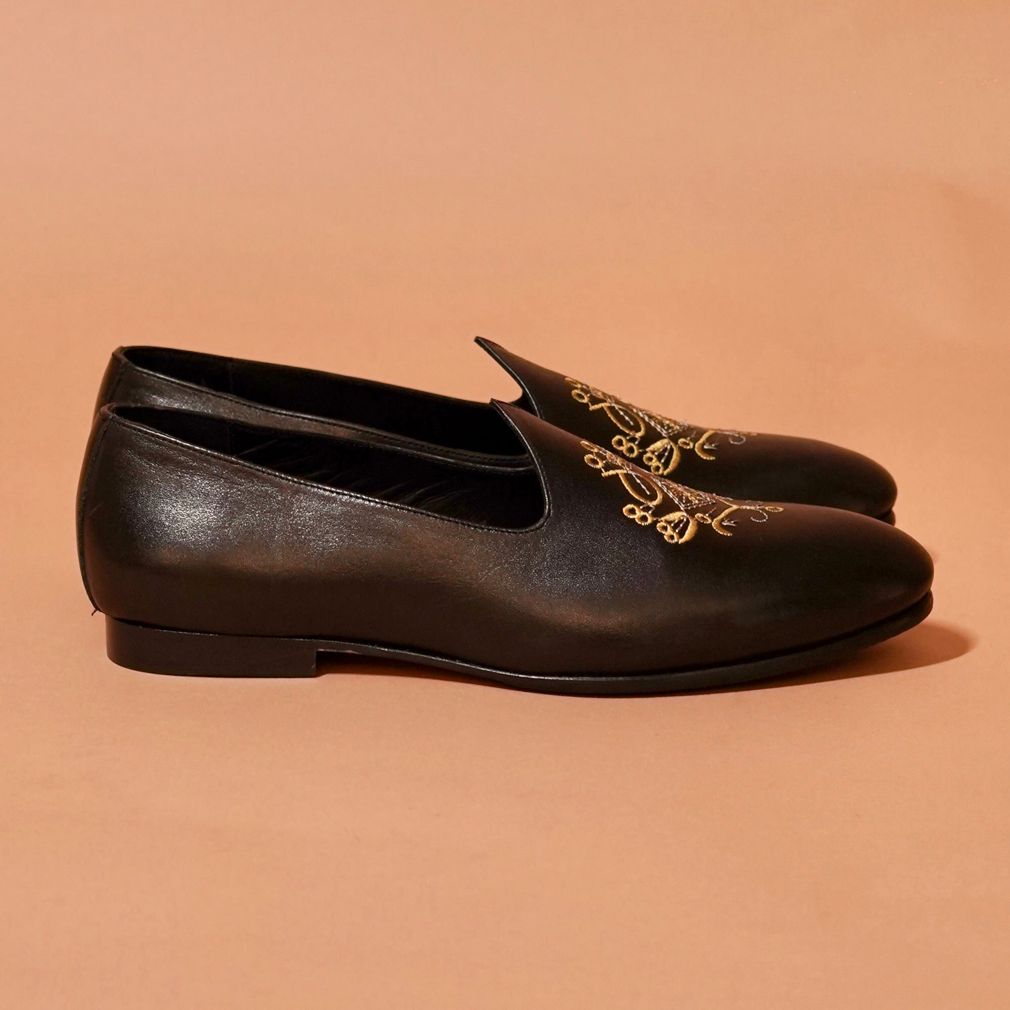 Side view of Ethnico Ricamo Nero showcasing gold embroidery on black leather