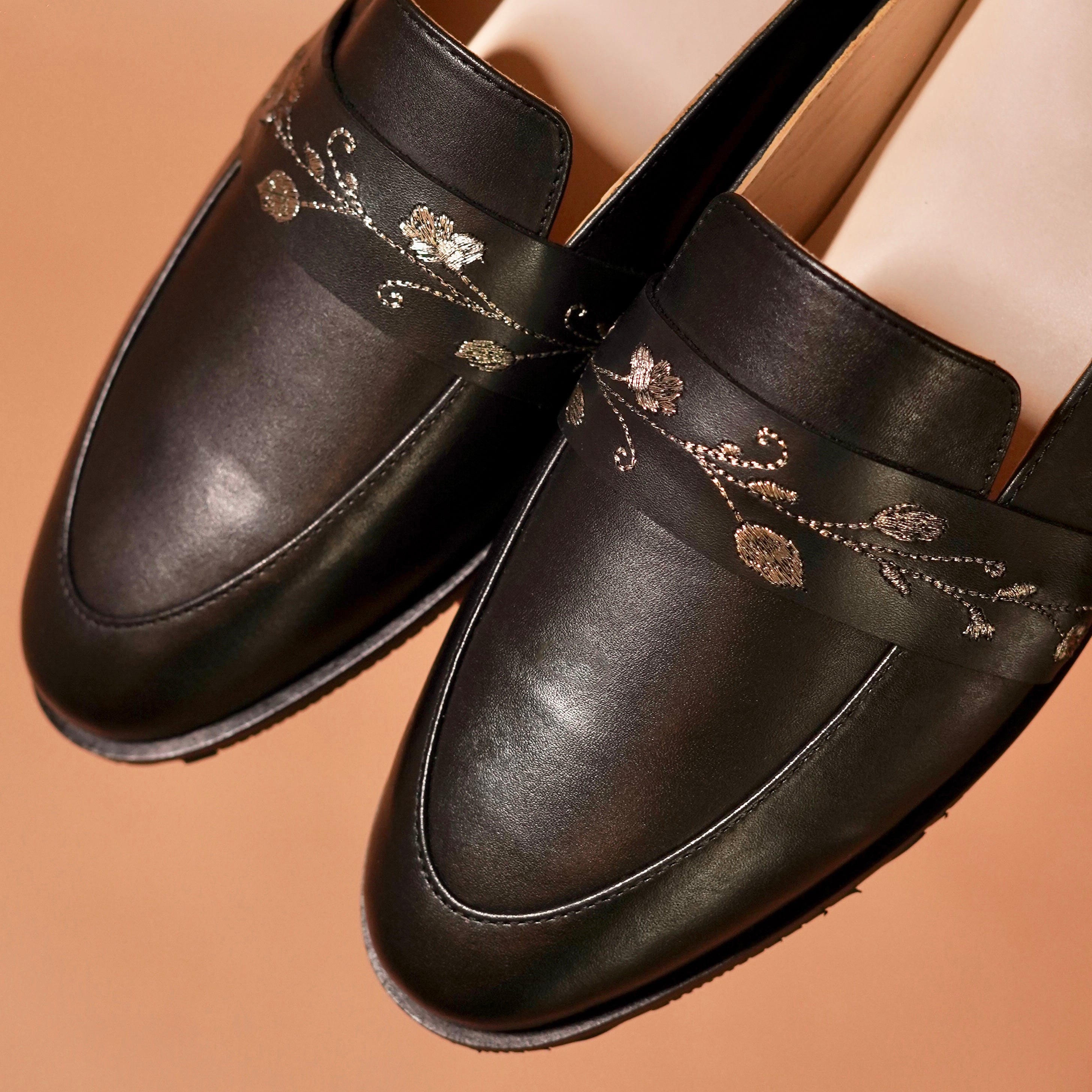 Close-up of hand-embroidered vine detail on Hoffler Ricamo Nero