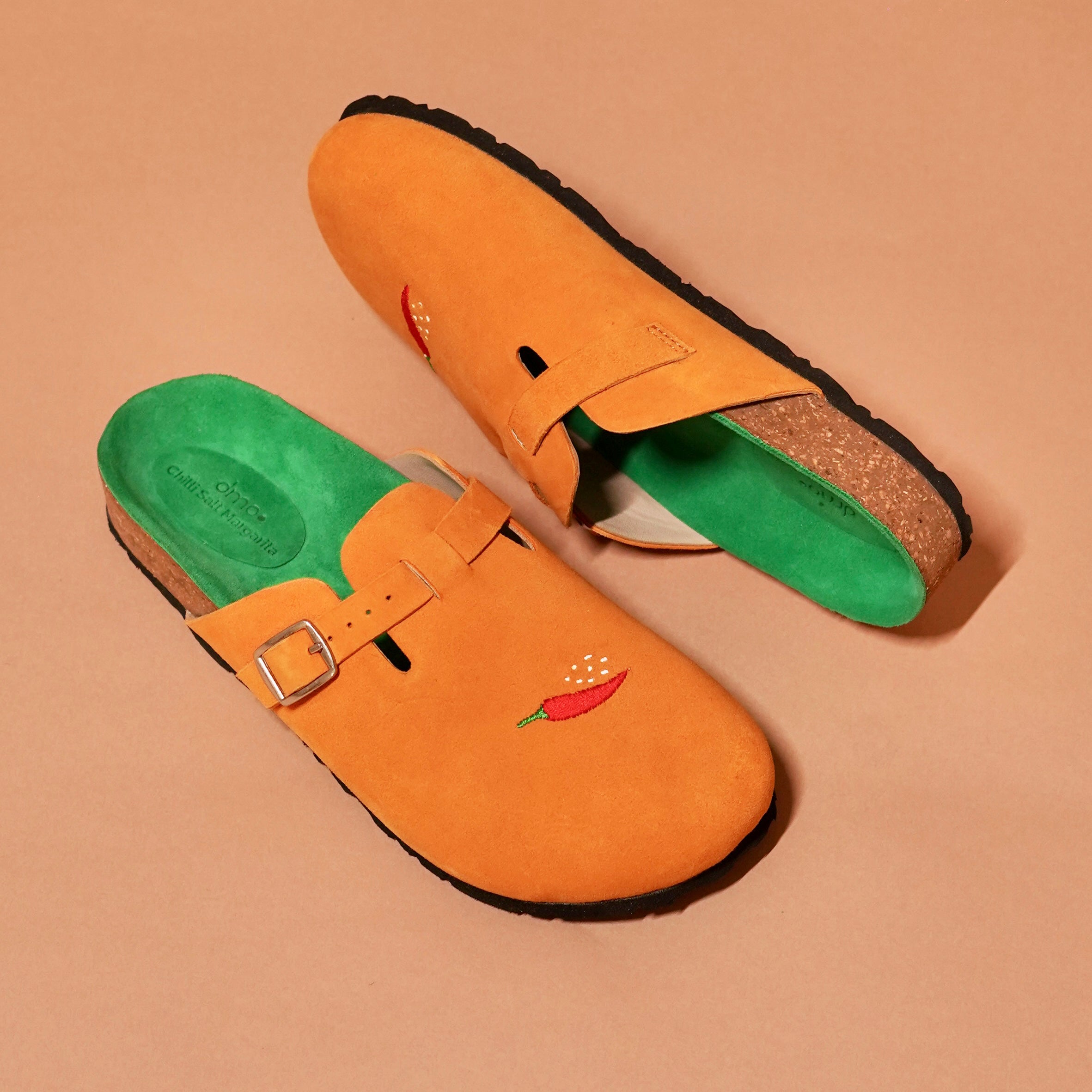 Top angle of Tangerine Mule highlighting cork sole and relaxed silhouette