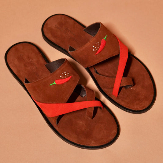 Detail of chilli embroidery on suede criss-cross strap of Chilli Slipper