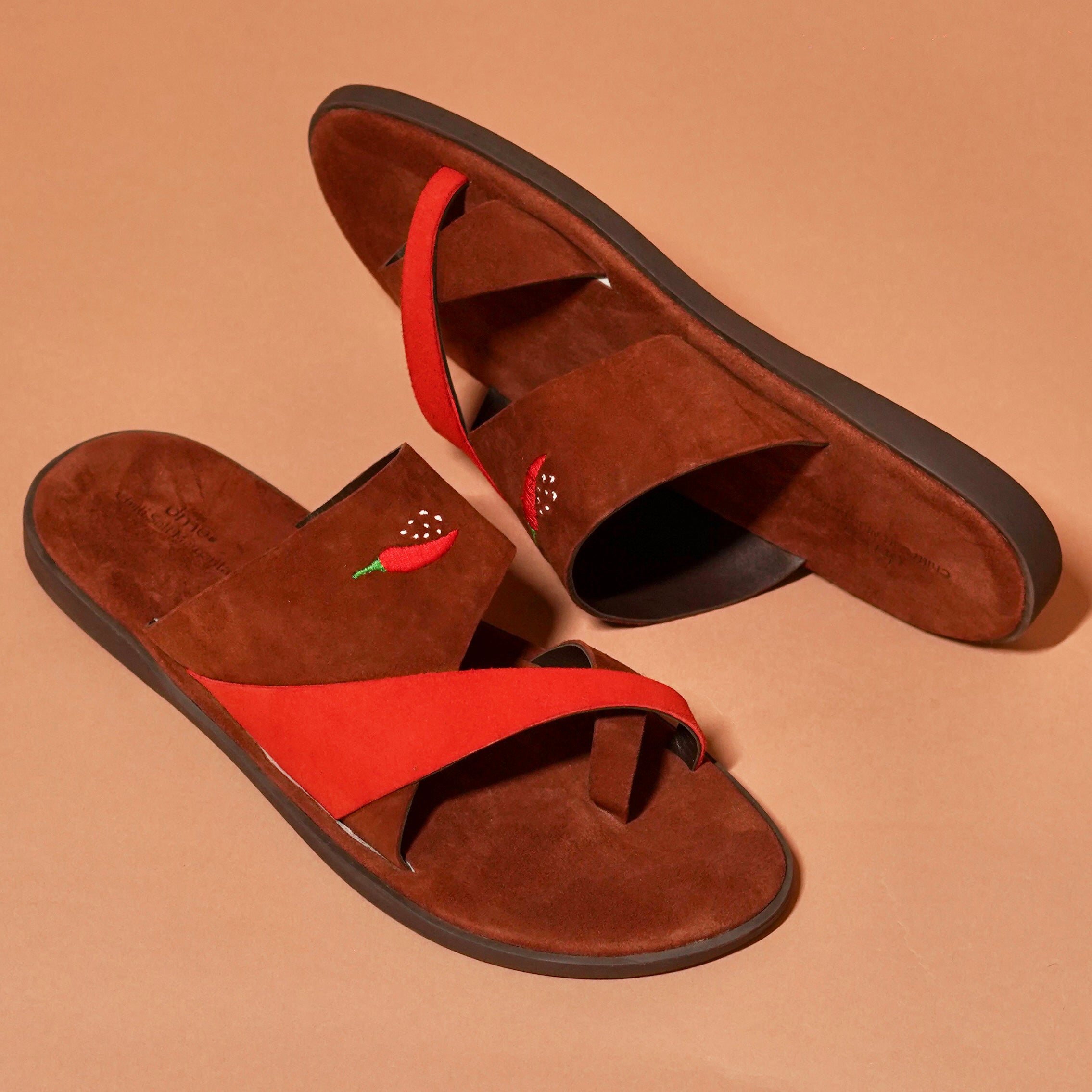Top view of Chilli Slipper with brown and red suede straps and toe loop