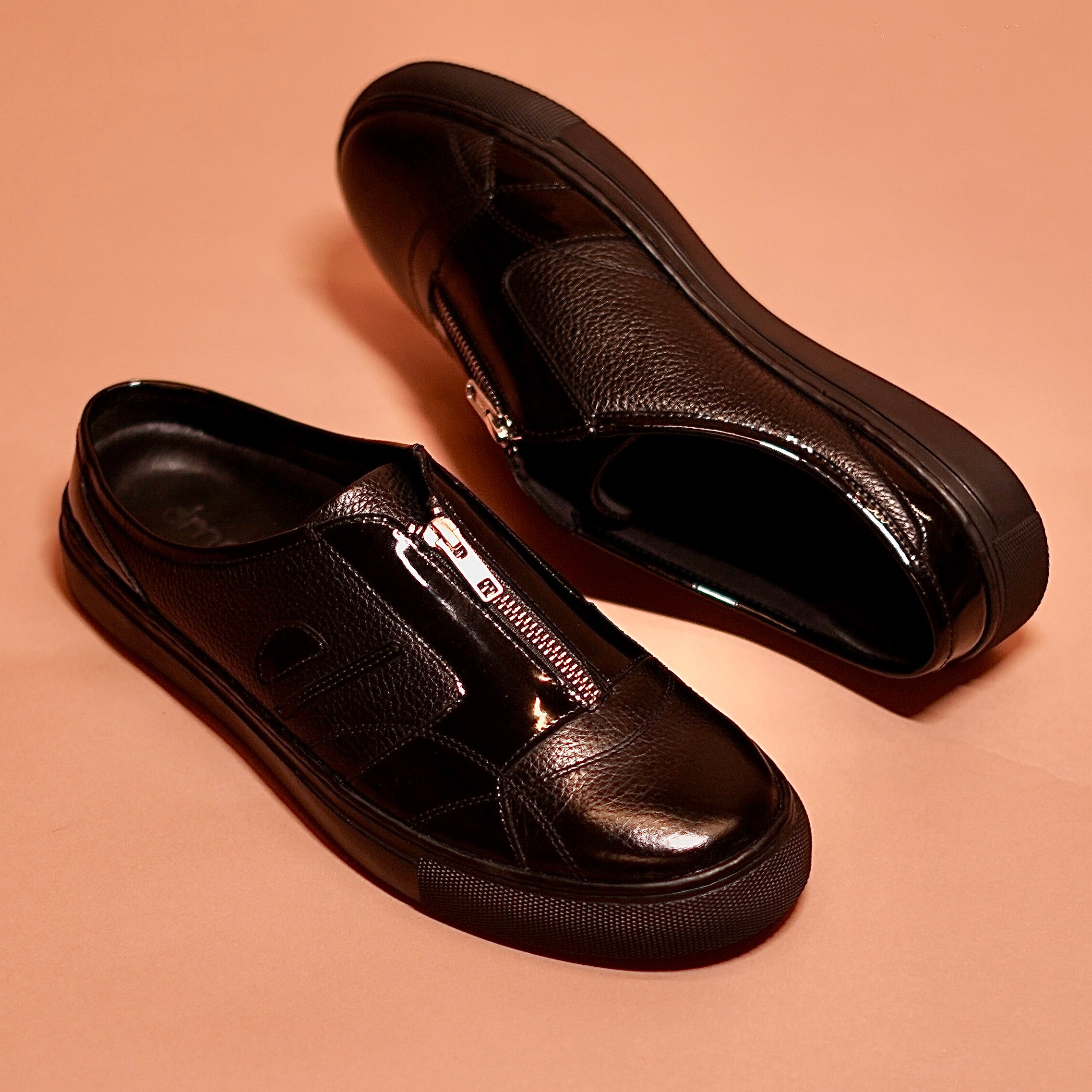 Close-up of sneaker sole and gloss leather upper