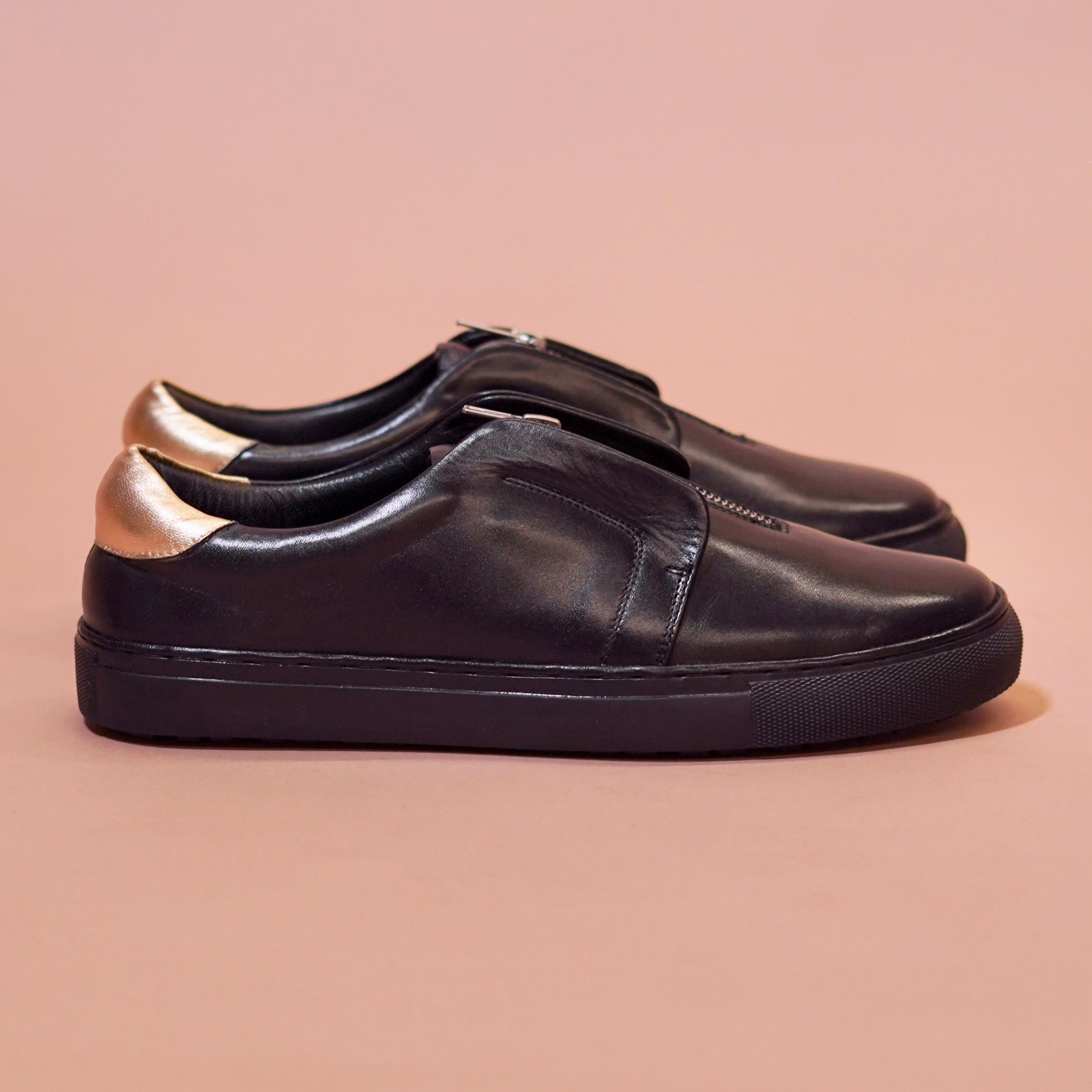 Pigro Nero | Black and gold zip-up leather sneakers