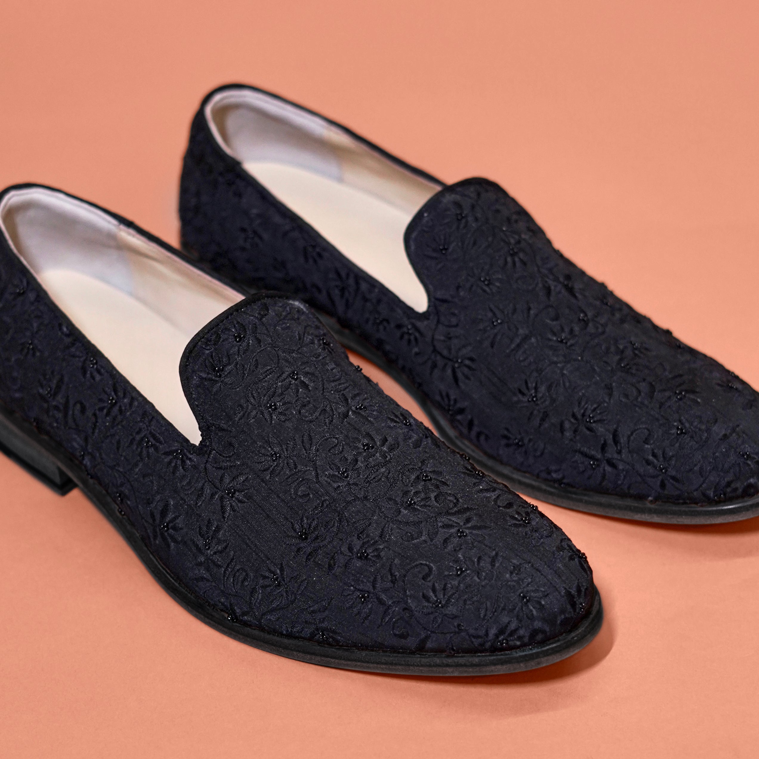 Close-up of hand-brushed brown leather finish and brogue detailing on Bruno Spazzolato