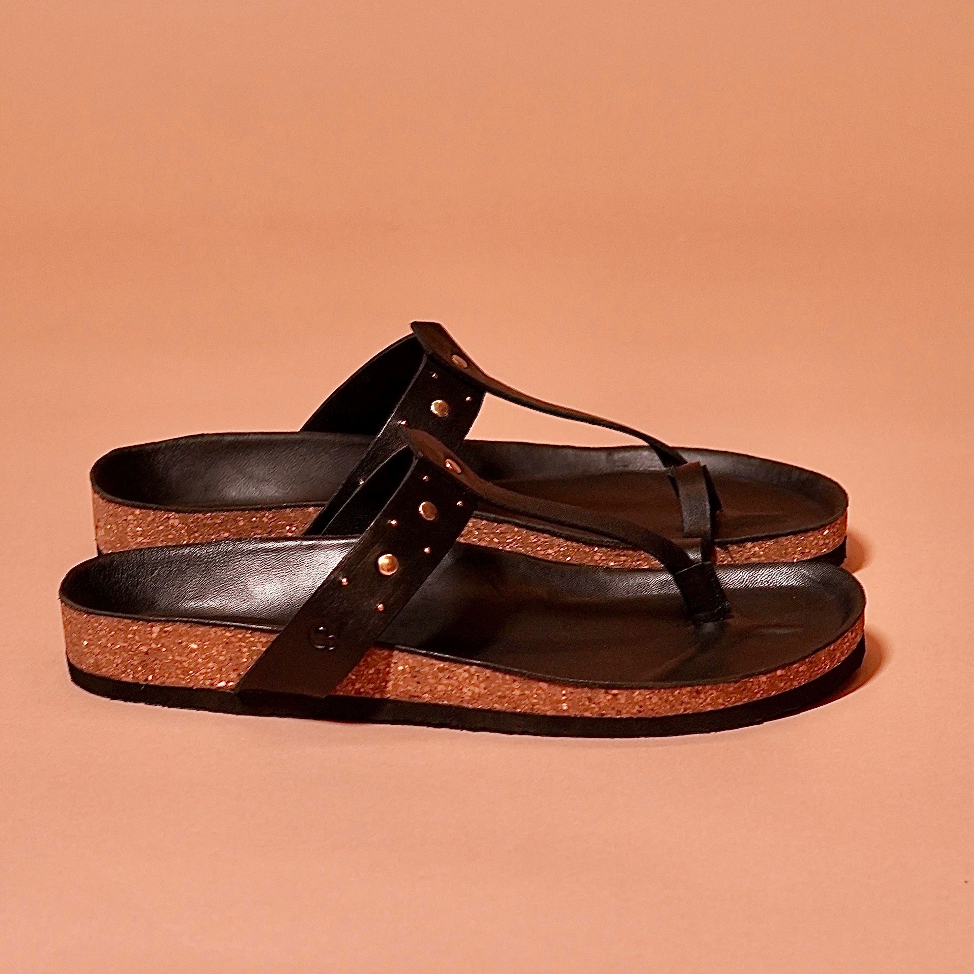 Black ethnic thong sandal with stud embellishments and cork base