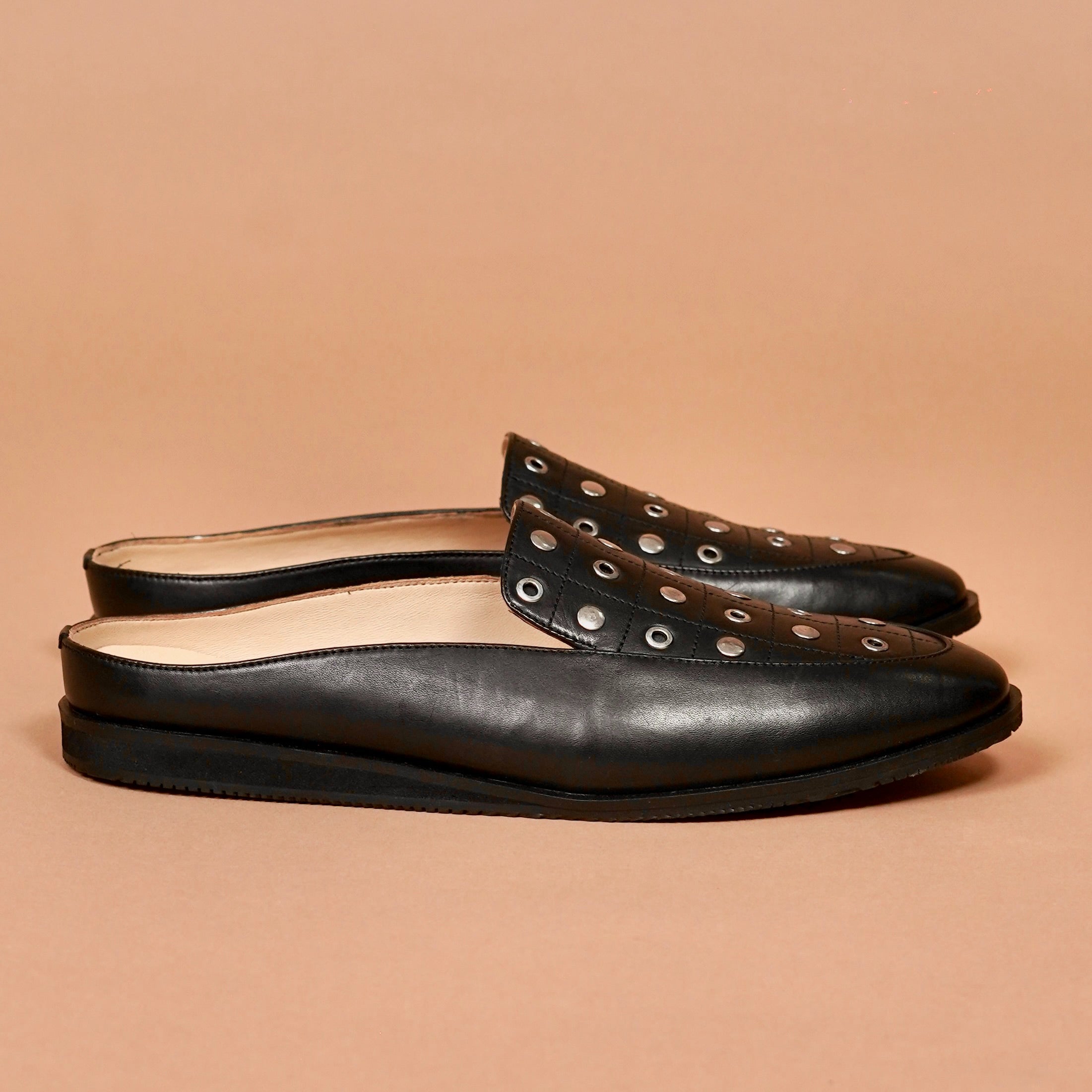 Side view of Hoffler Nero Riveto leather backless ethnic shoe