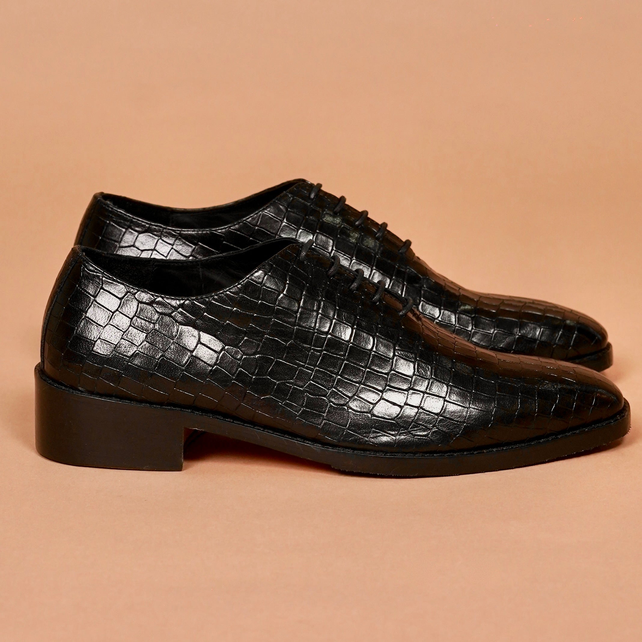 Side angle of Caro Croco showing laced front and pointed toe