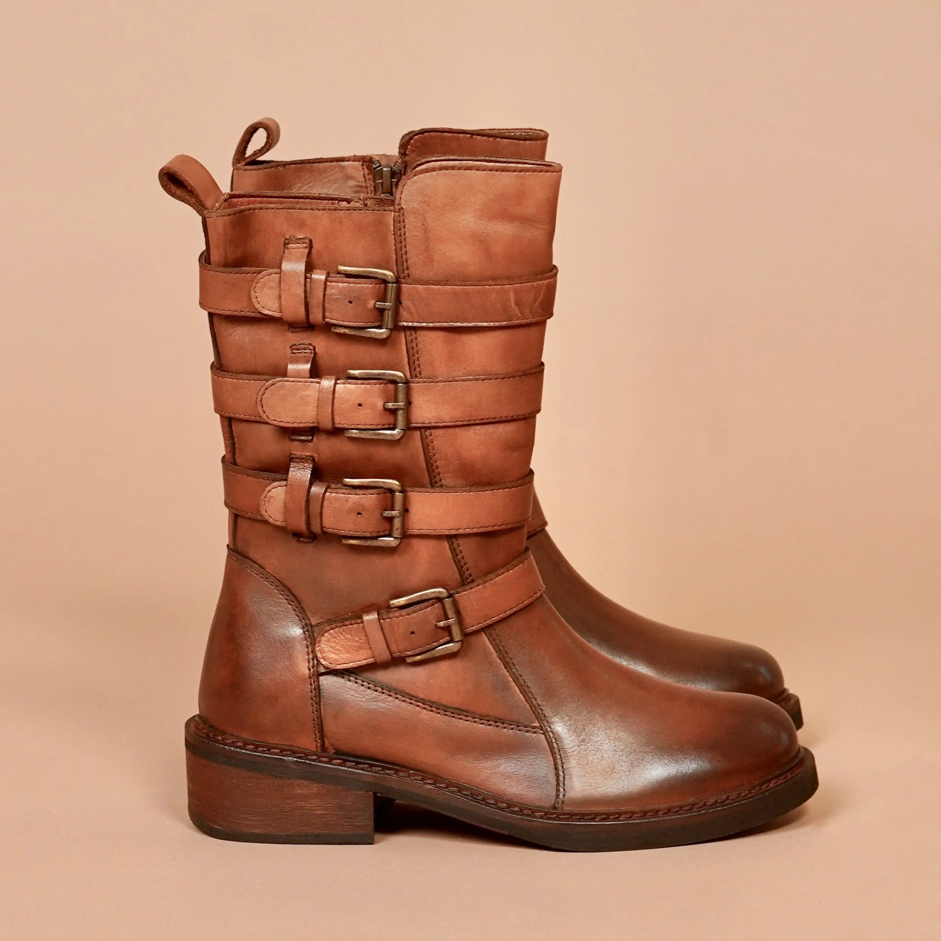 Side view of high shaft leather boots for women