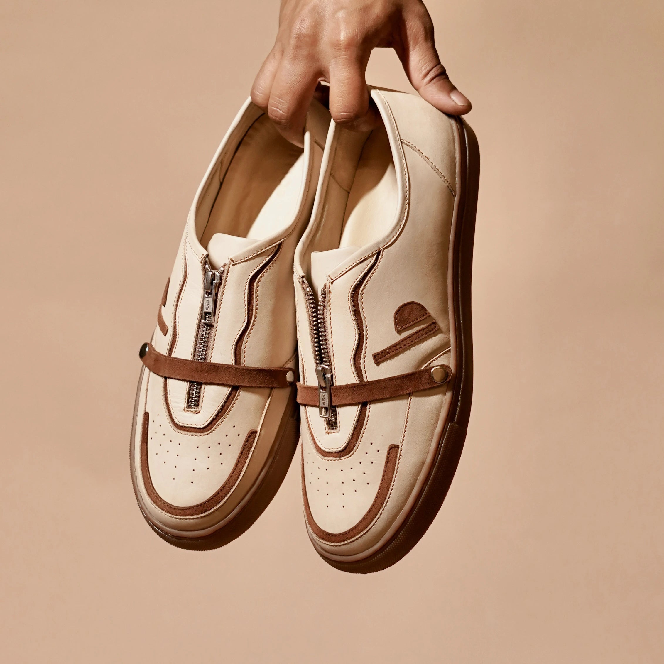 Detail shot of suede overlay and zipper closure on Scarpo Mocha