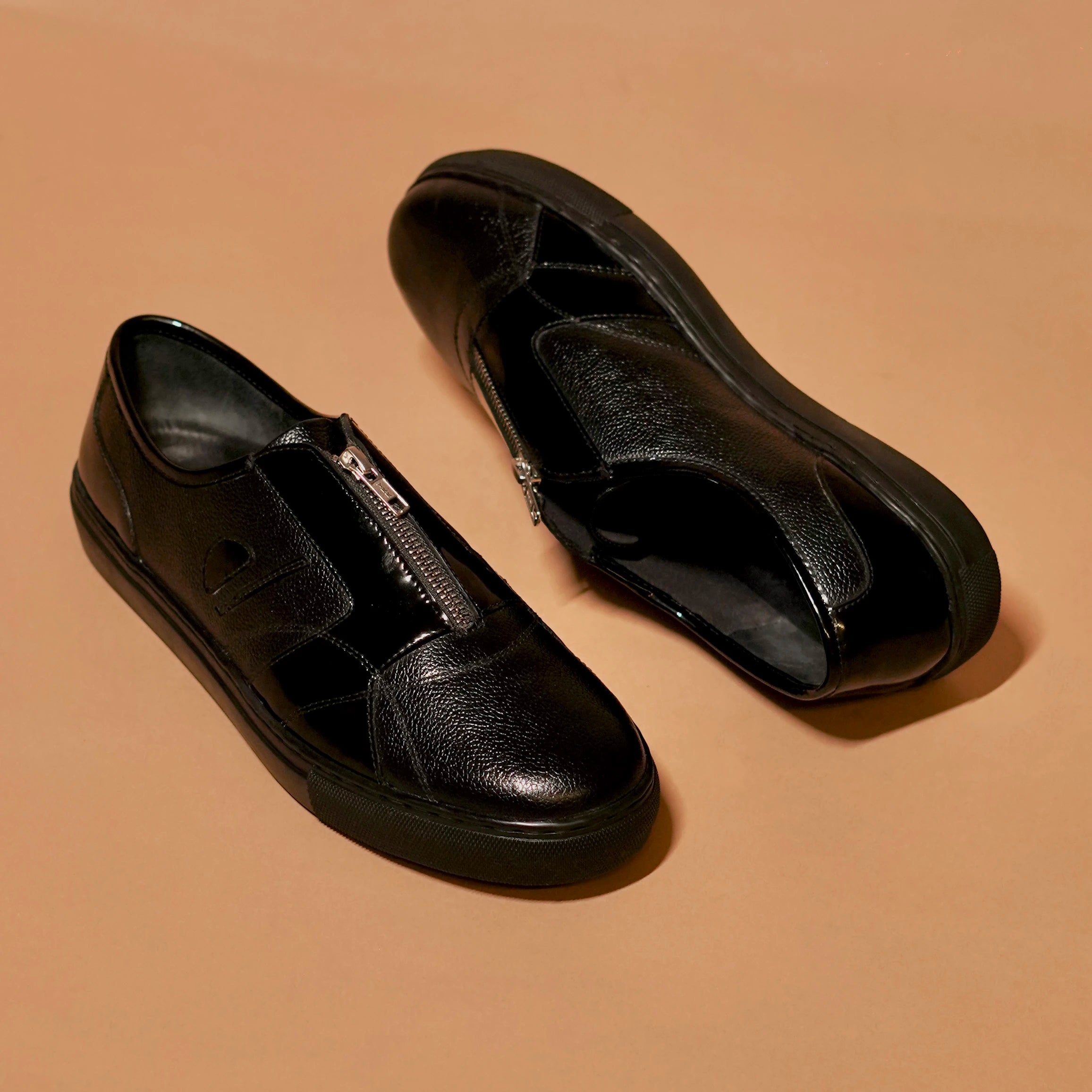 Textured and patent black leather zip sneaker