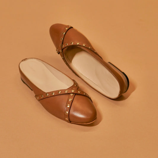 Styled brown leather mule with neutral outfit