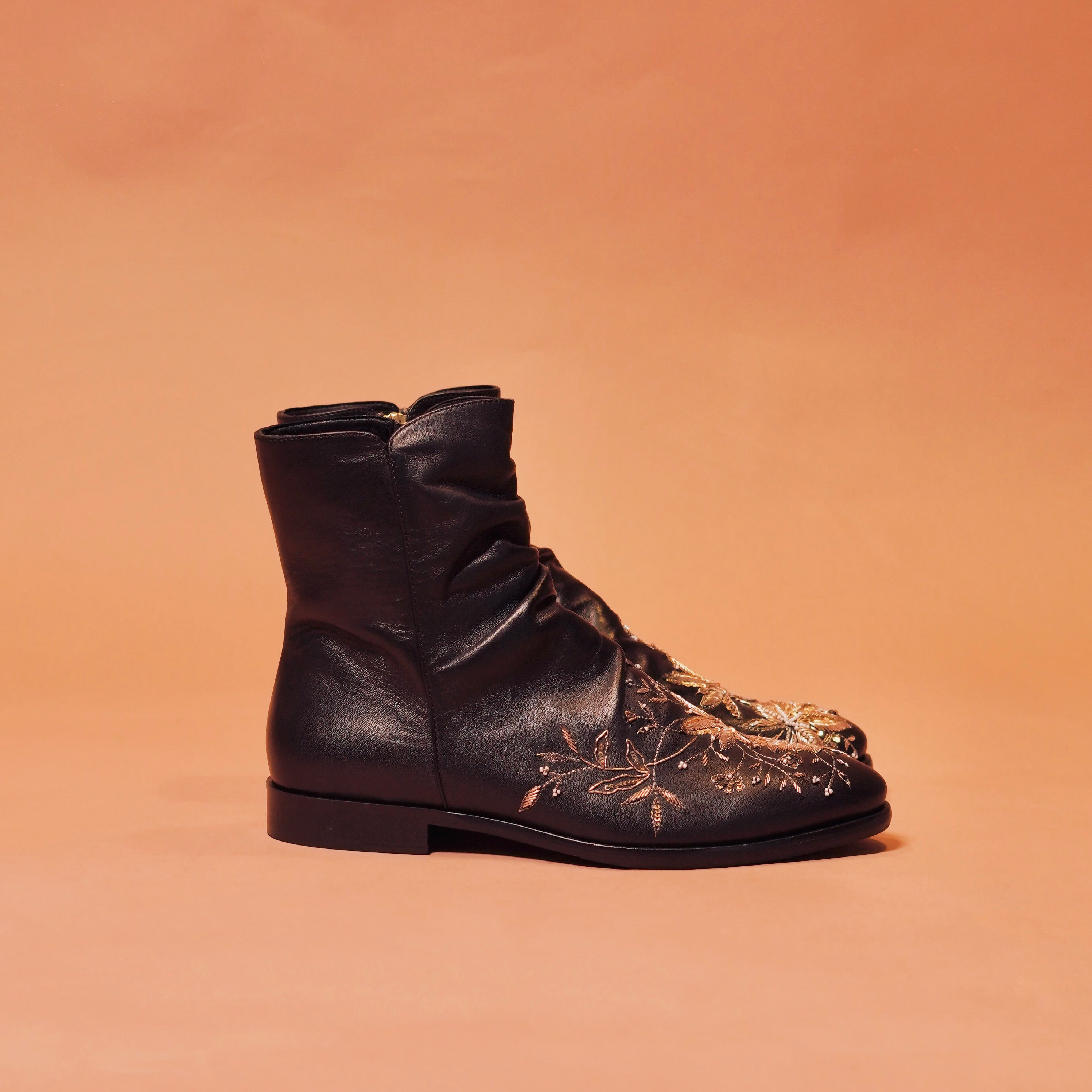 Side view of Sprazo Nero Ricamo showcasing wrinkled Napa leather and zardozi embroidery