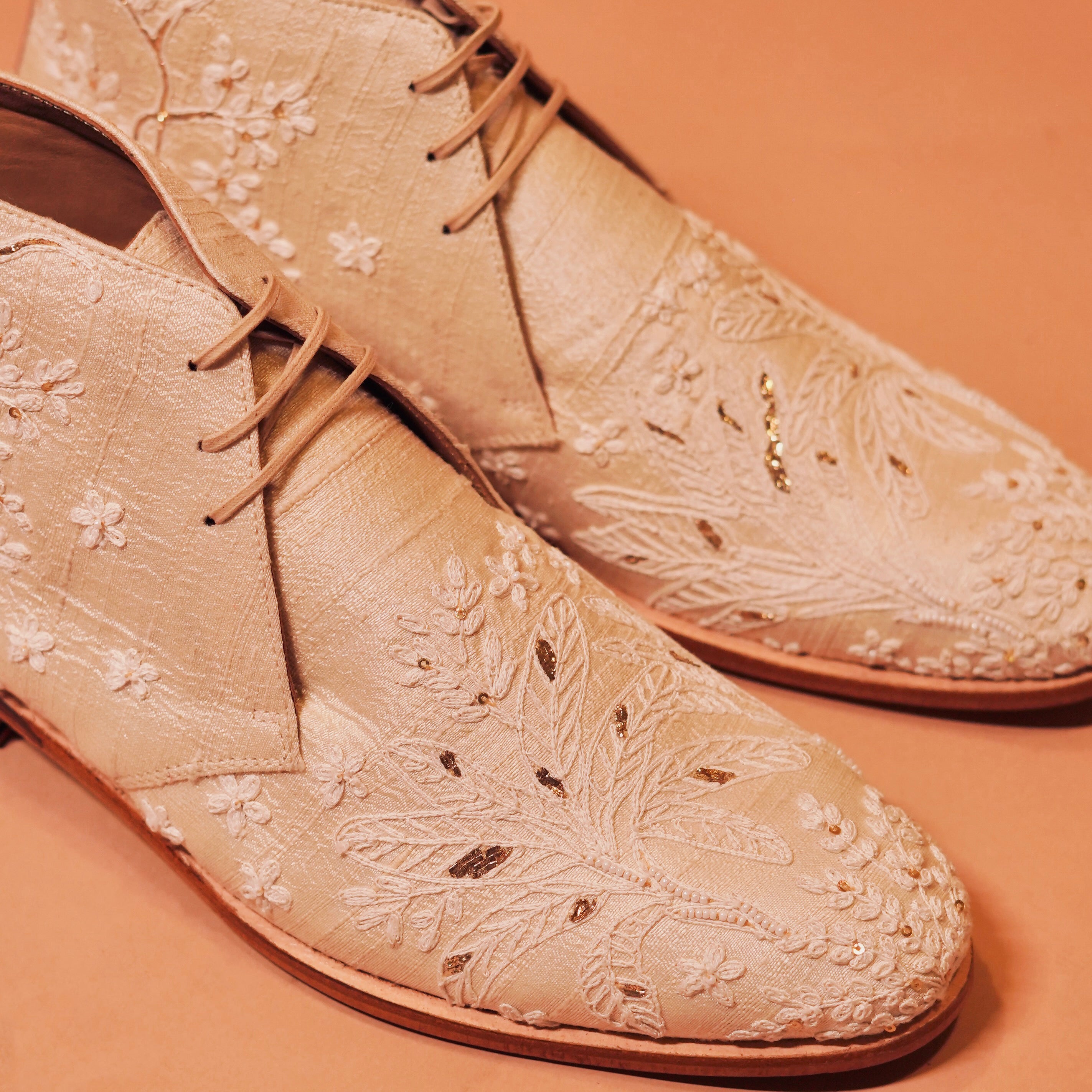 Close-up of Sprazo Nozzo’s raw silk texture and zardozi details