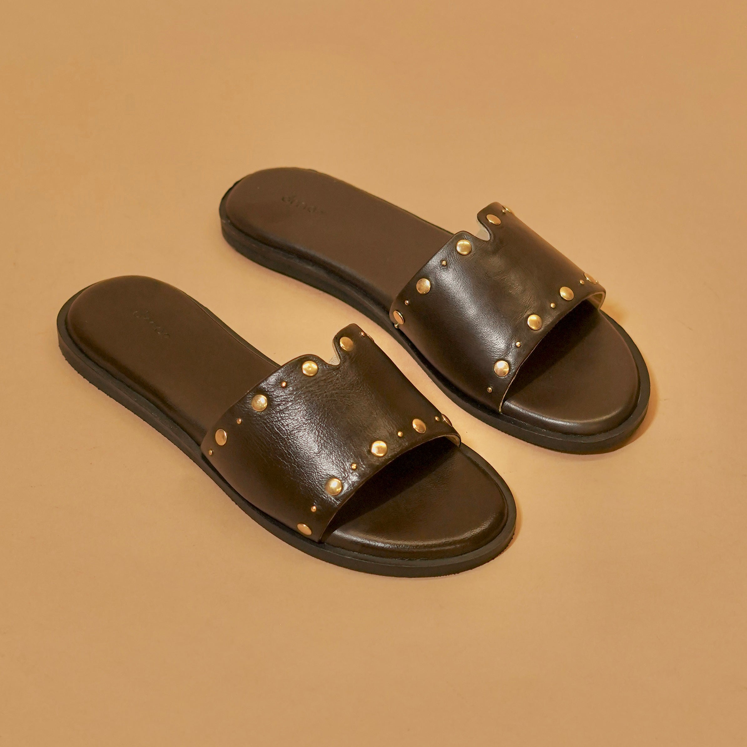 Brown leather sliders with gold rivets