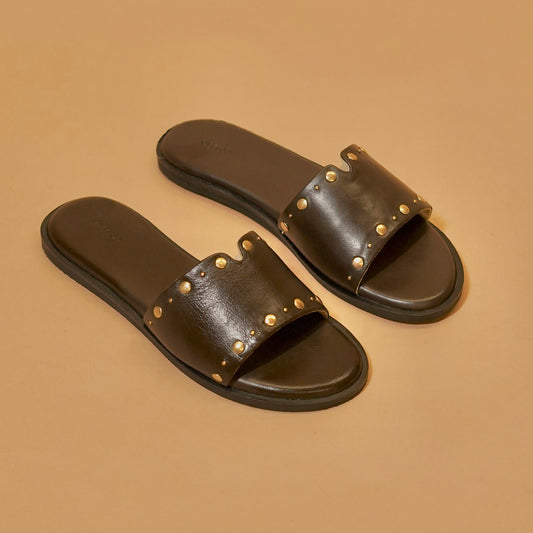 Brown leather sliders with gold rivets