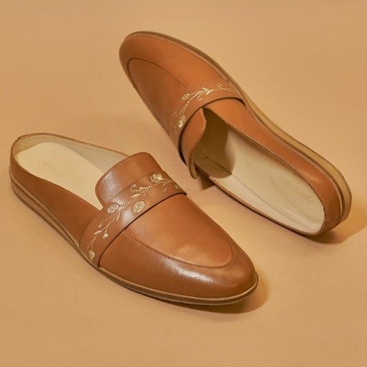 Three-fourth view of embroidered men’s mule