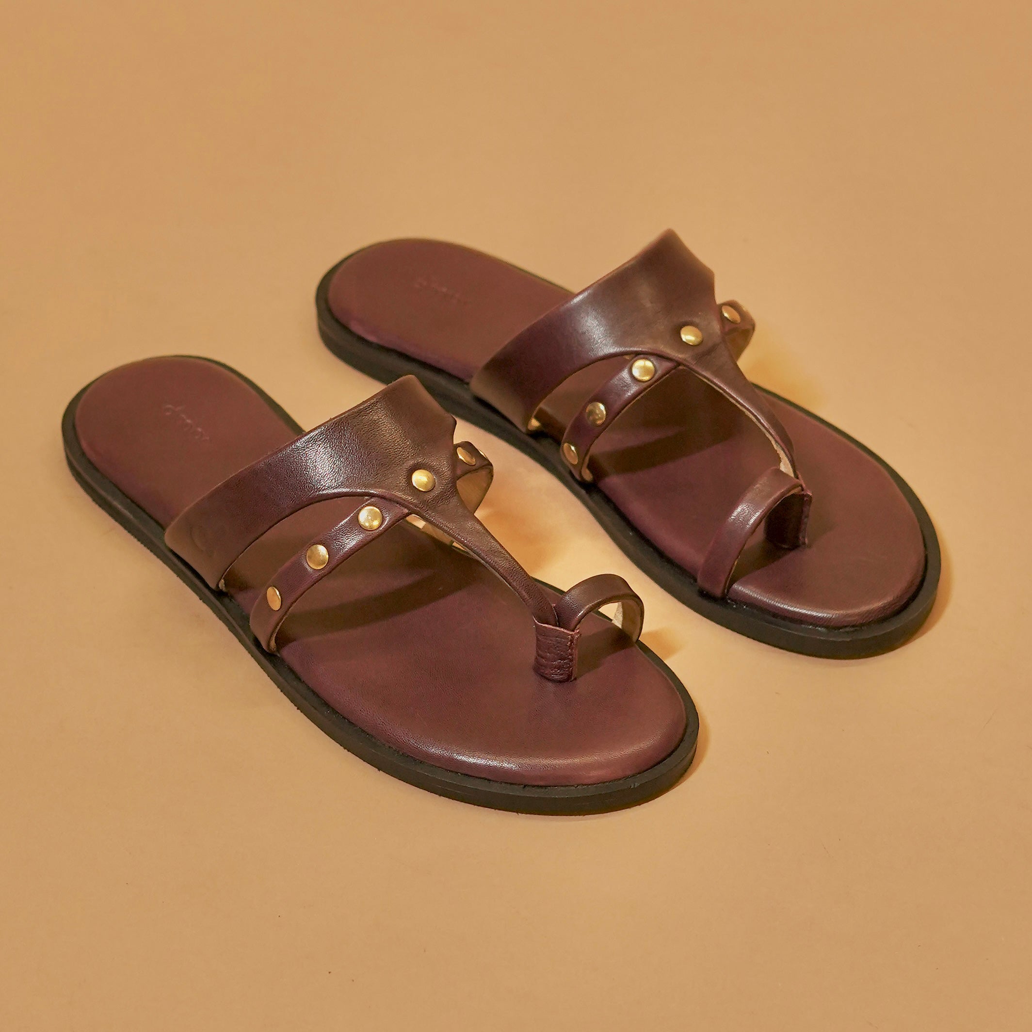 Plum leather Chappals with toe loop and brass studs