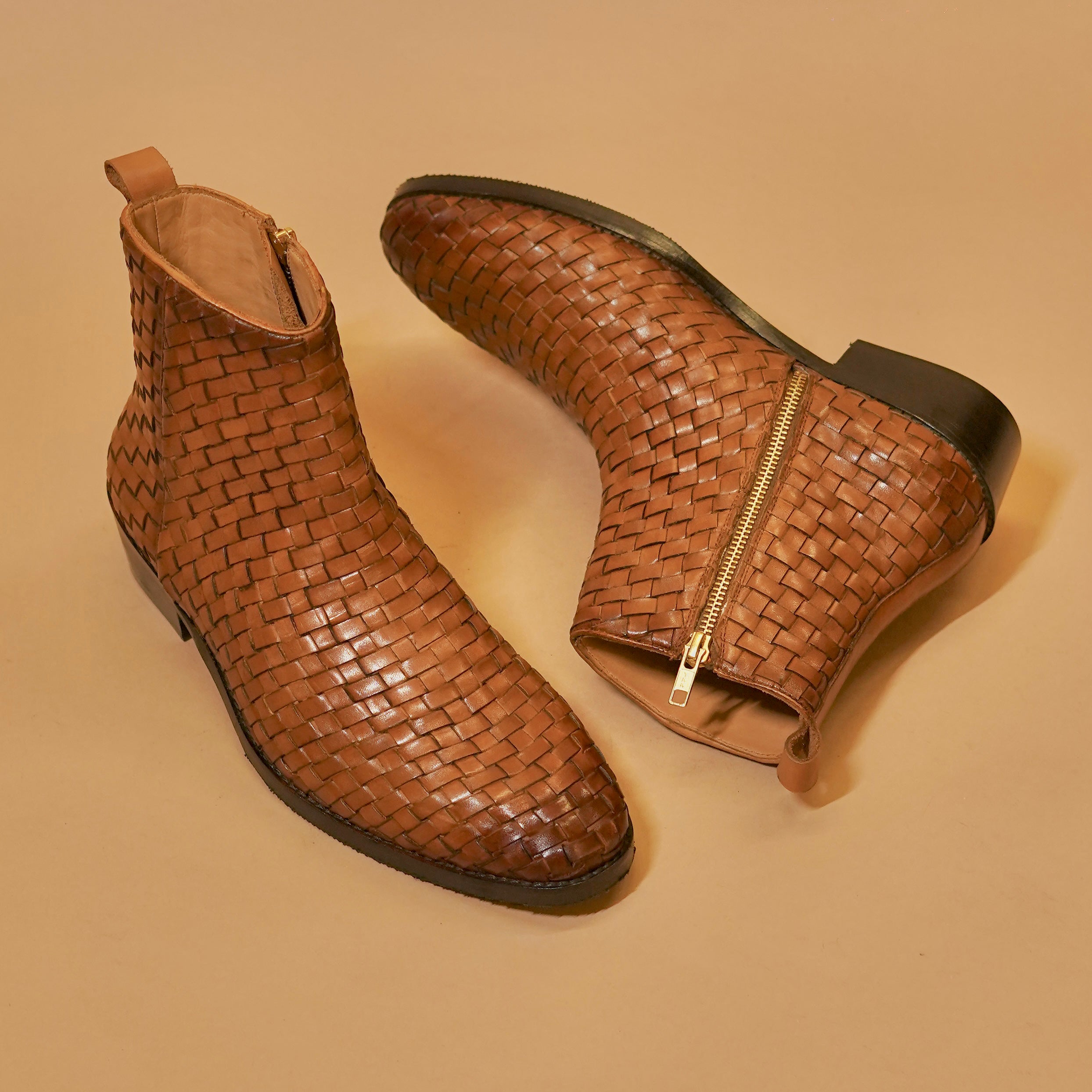  Three-quarter view of brown weaved men’s boot