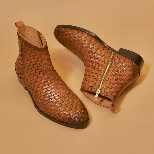  Three-quarter view of brown weaved men’s boot