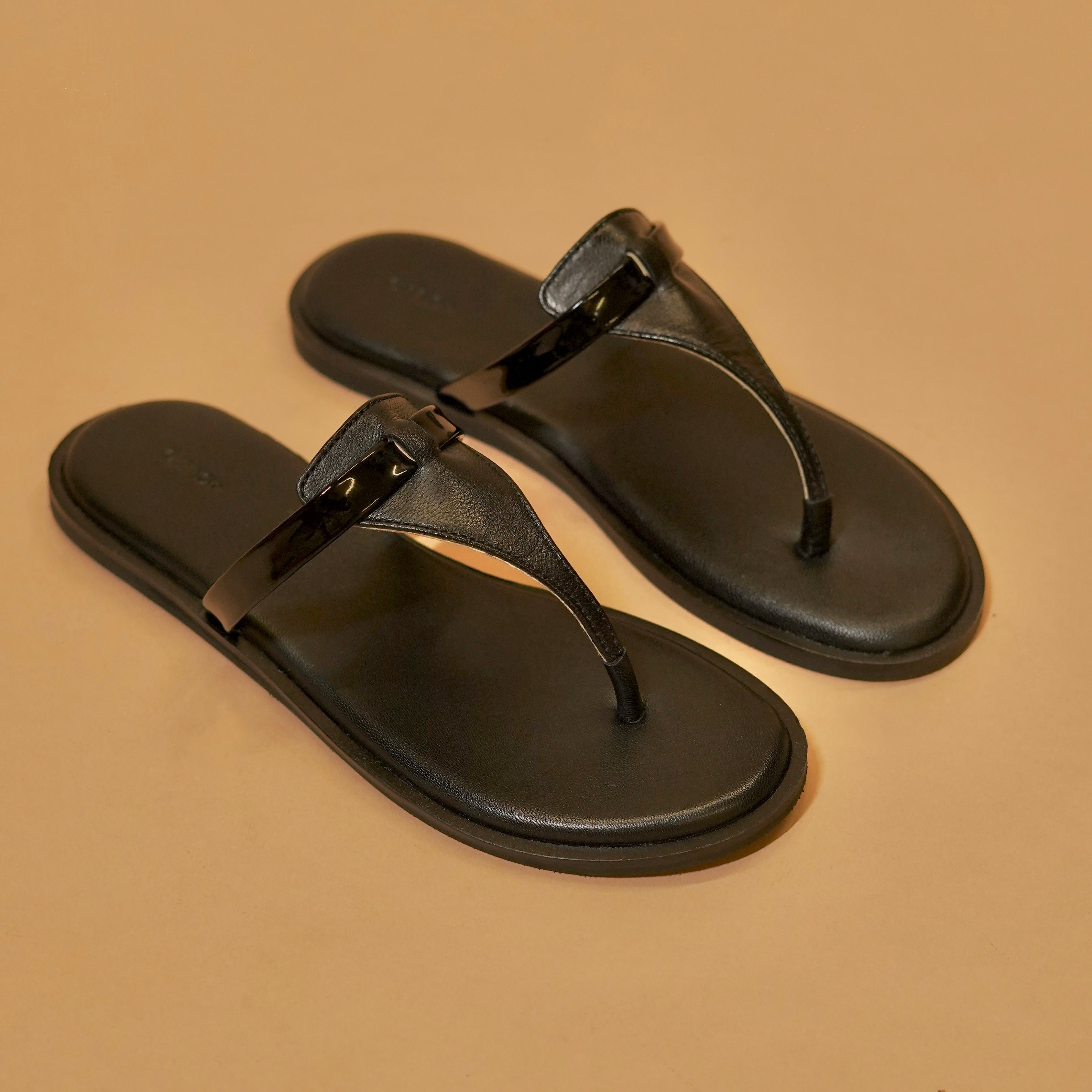 Black slipper with glossy strap