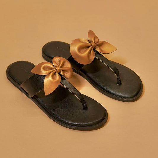 Black chappals with copper bow detail
